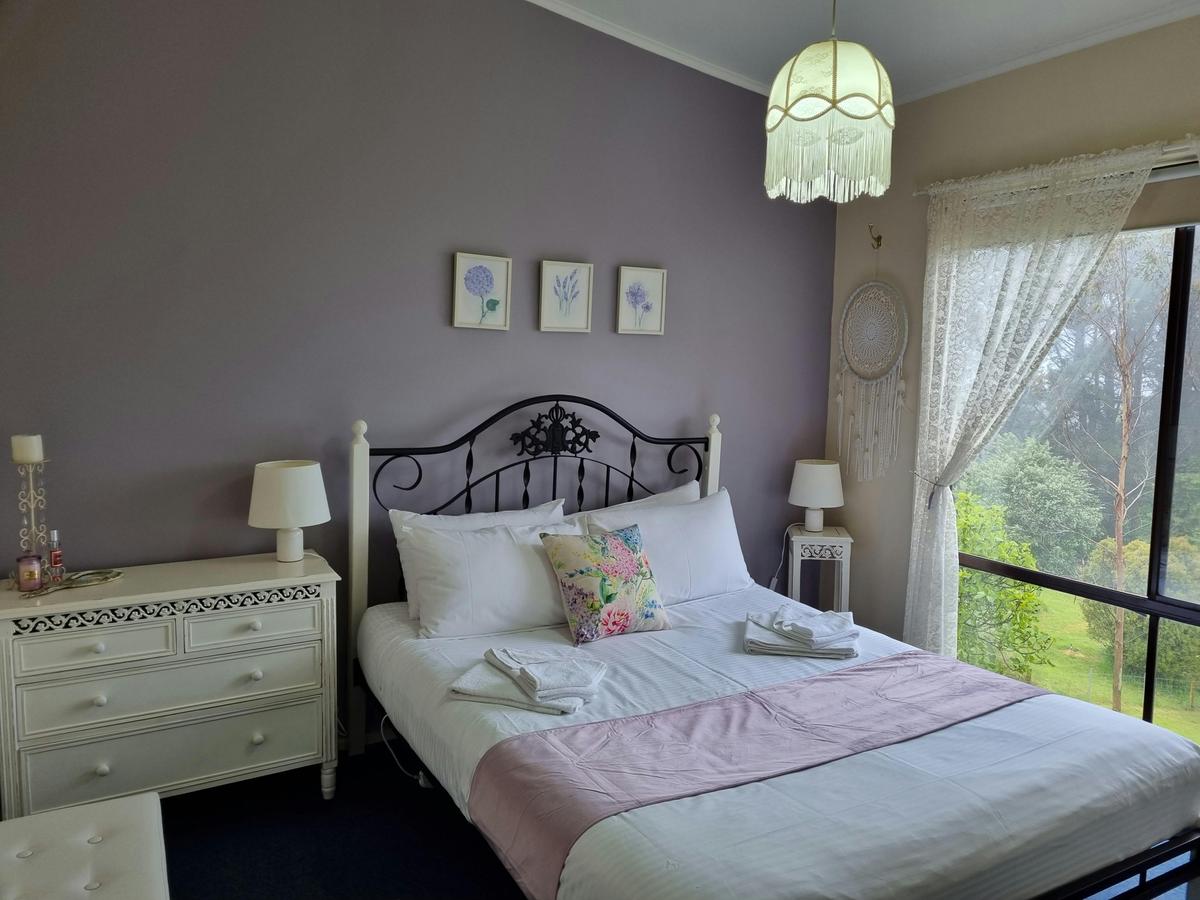 Bedroom 1 with queen bed in Beech Forest Cottage