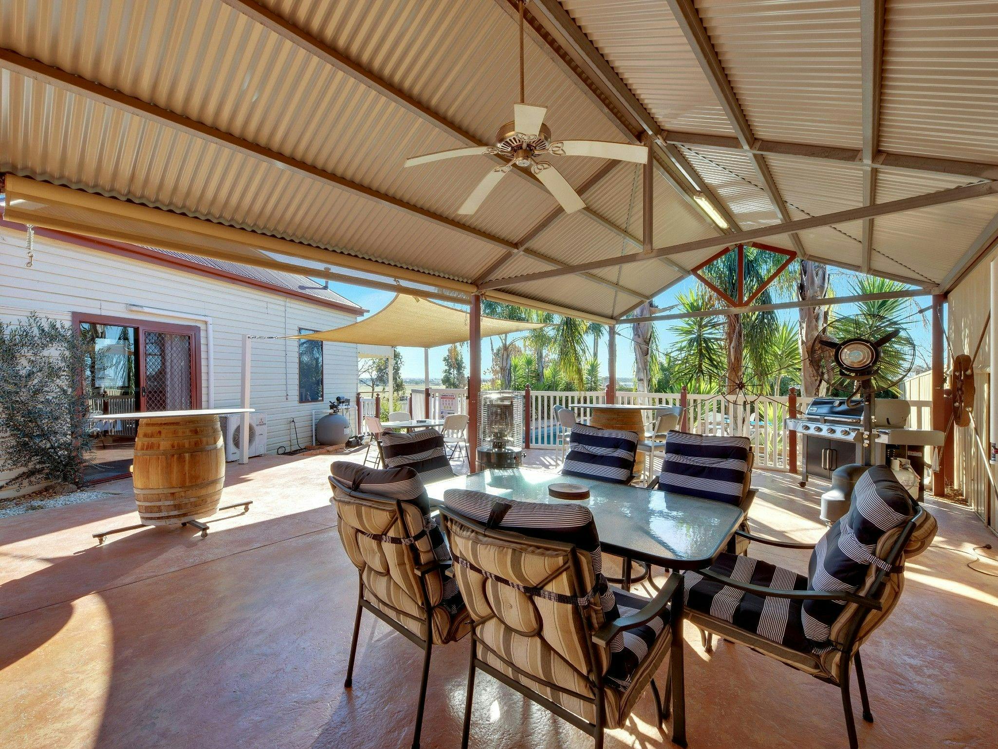 Alfresco dining area next to the pool