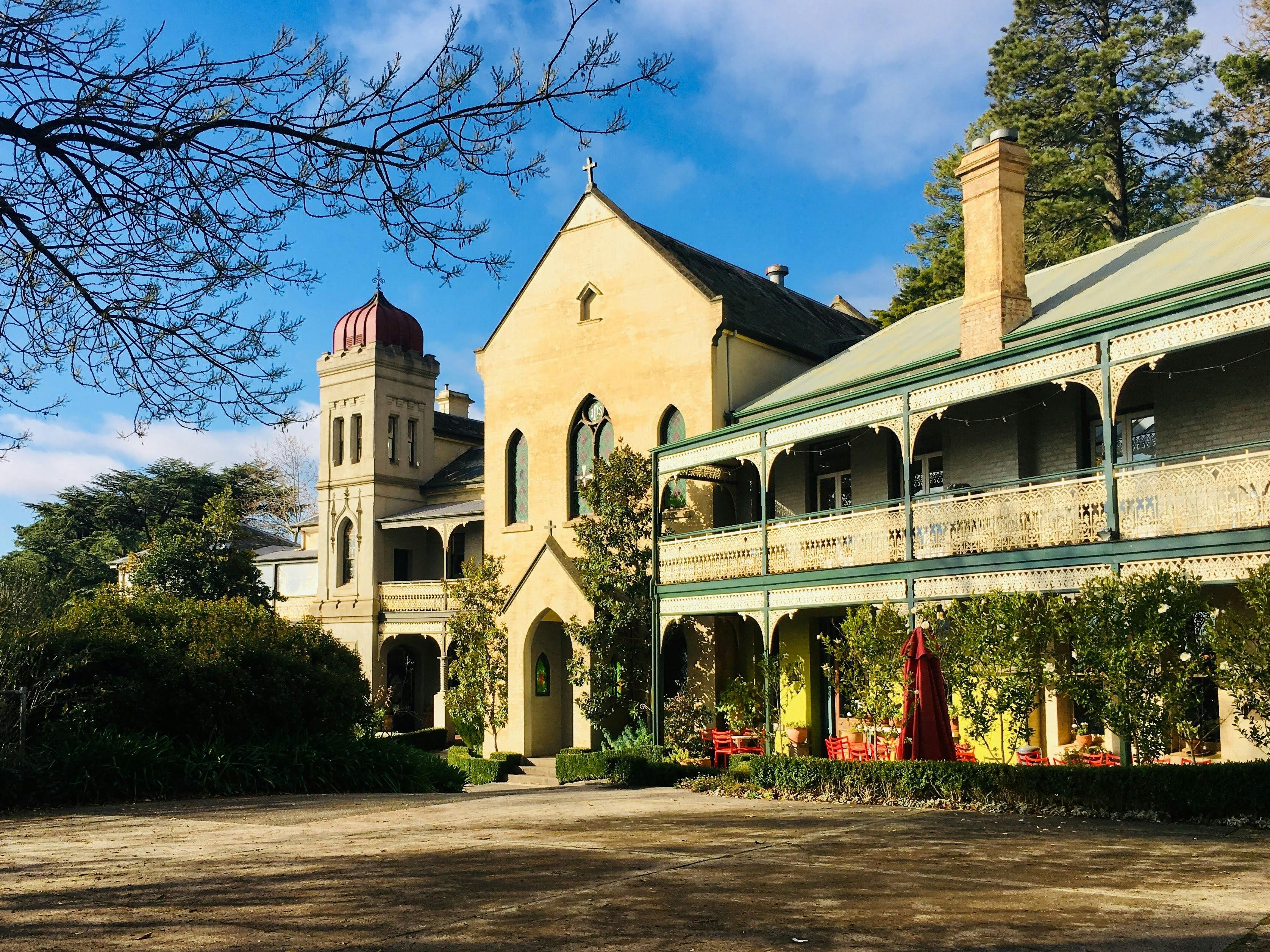 external facade of the convent including the chapel, tower and bar.