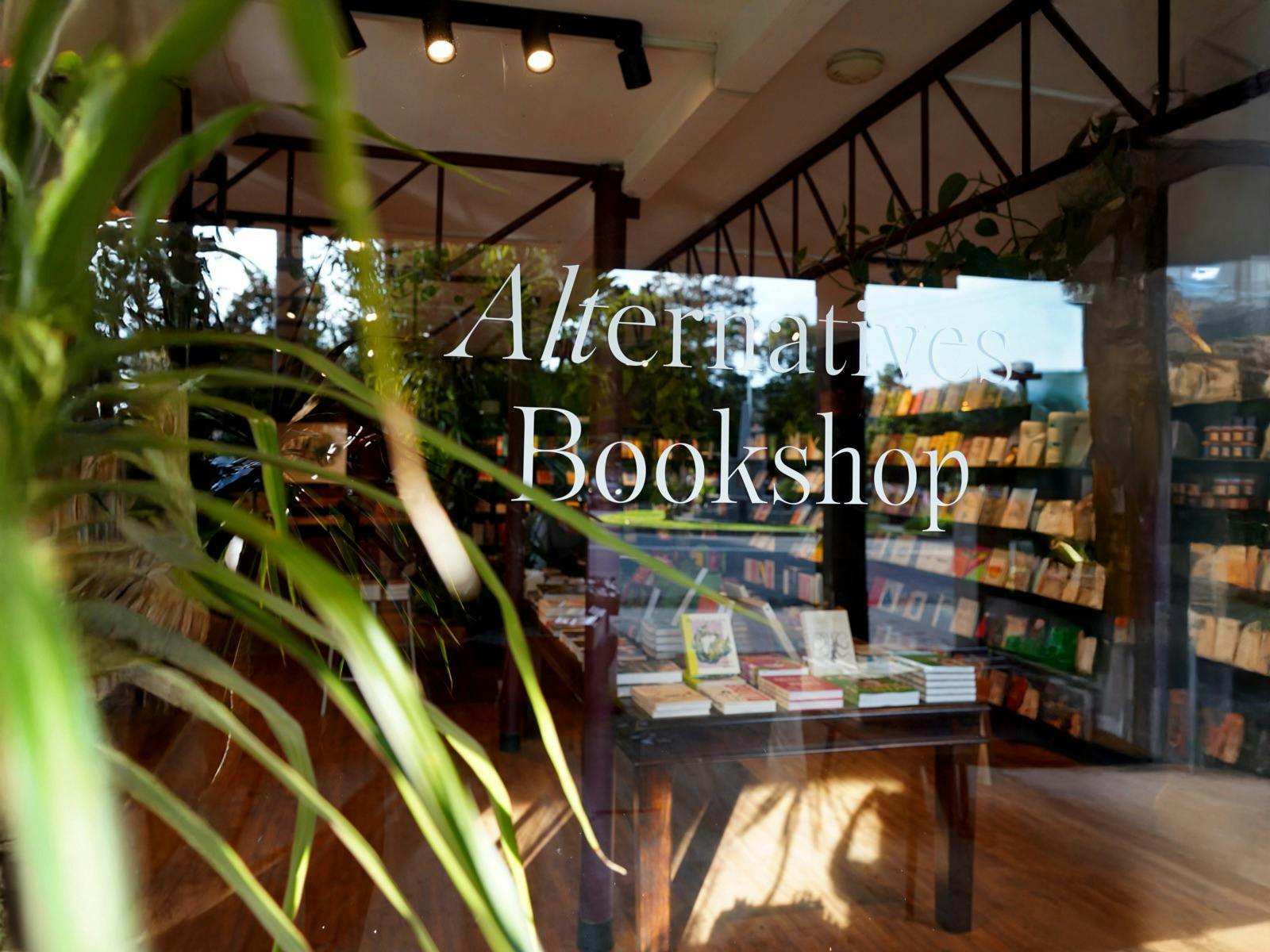 A look through the window to see books on the shelves inside the shop