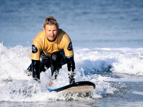 Build balance and confidence in small-group surf lessons.