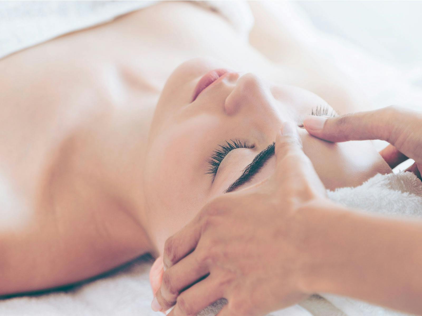A female customer receiving a facial massage