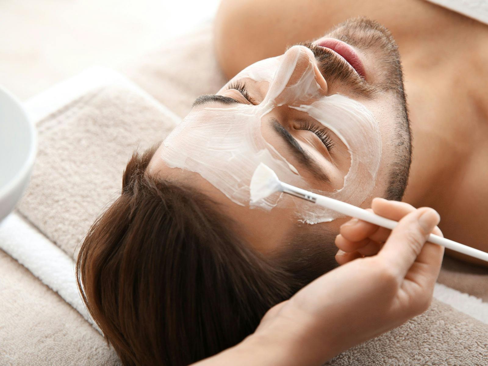 A facial treatment for a male customer