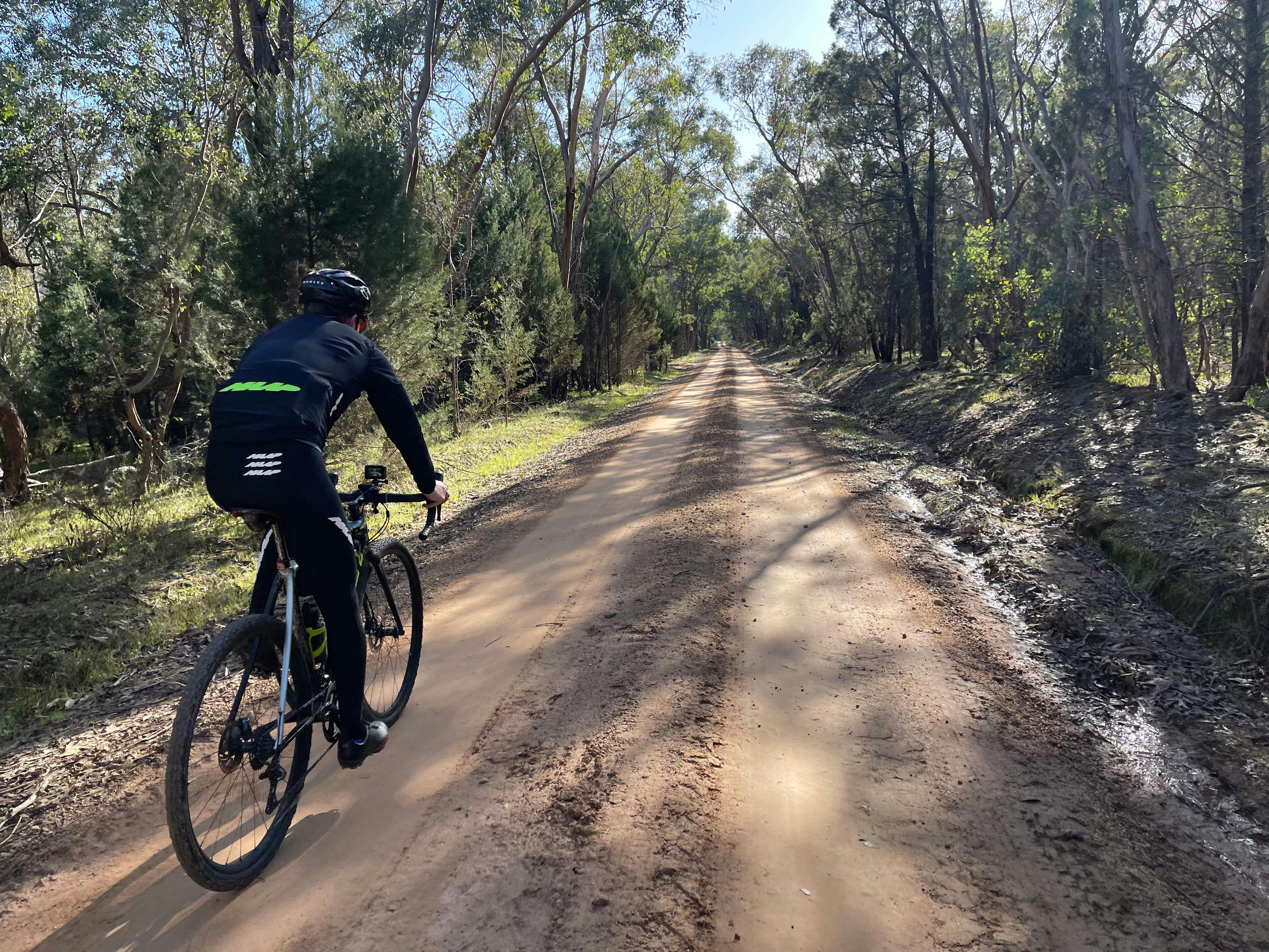Cyclist on Gravel Road in the Mt Pilot National Park