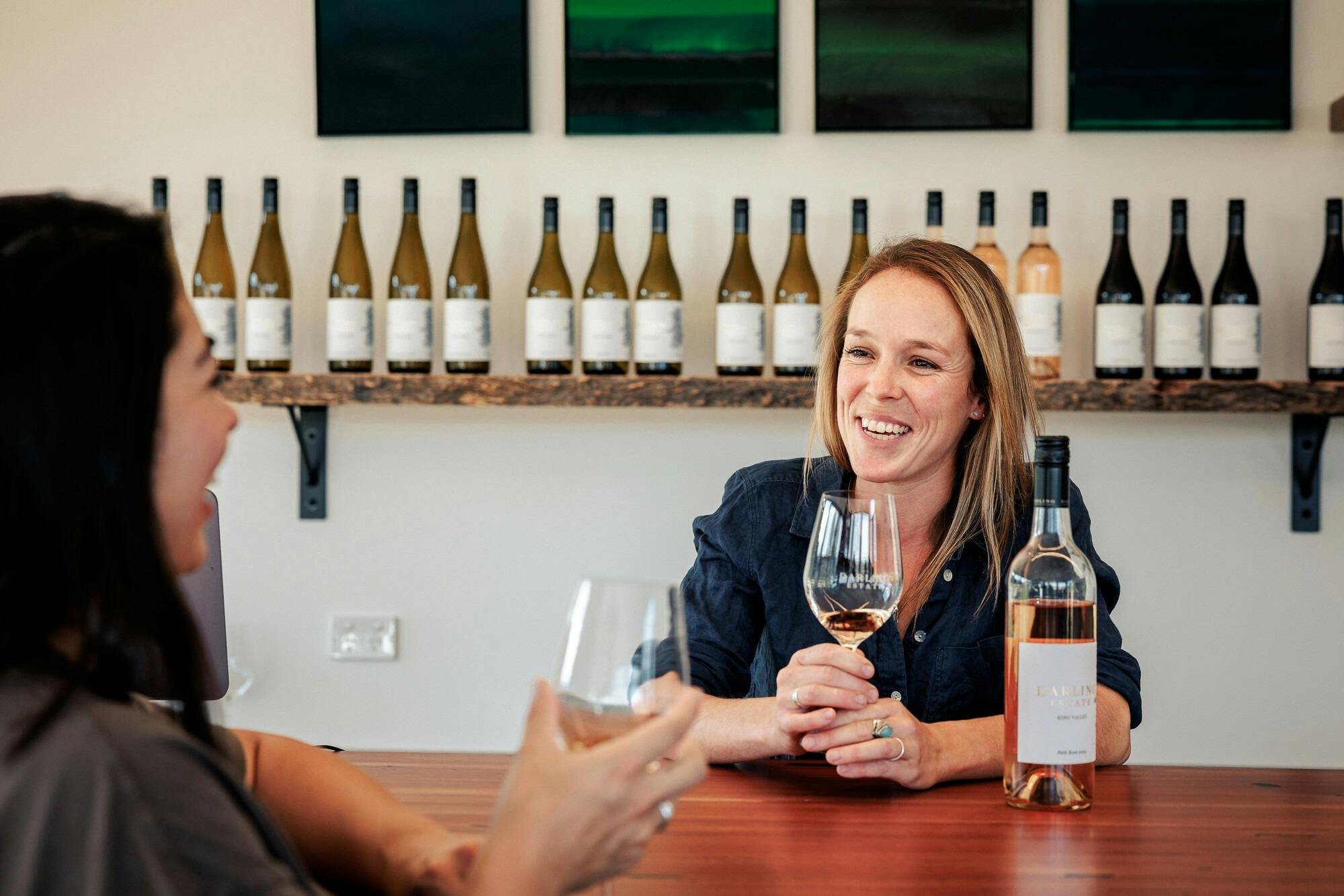 Tasting wine at the bar at cellar door