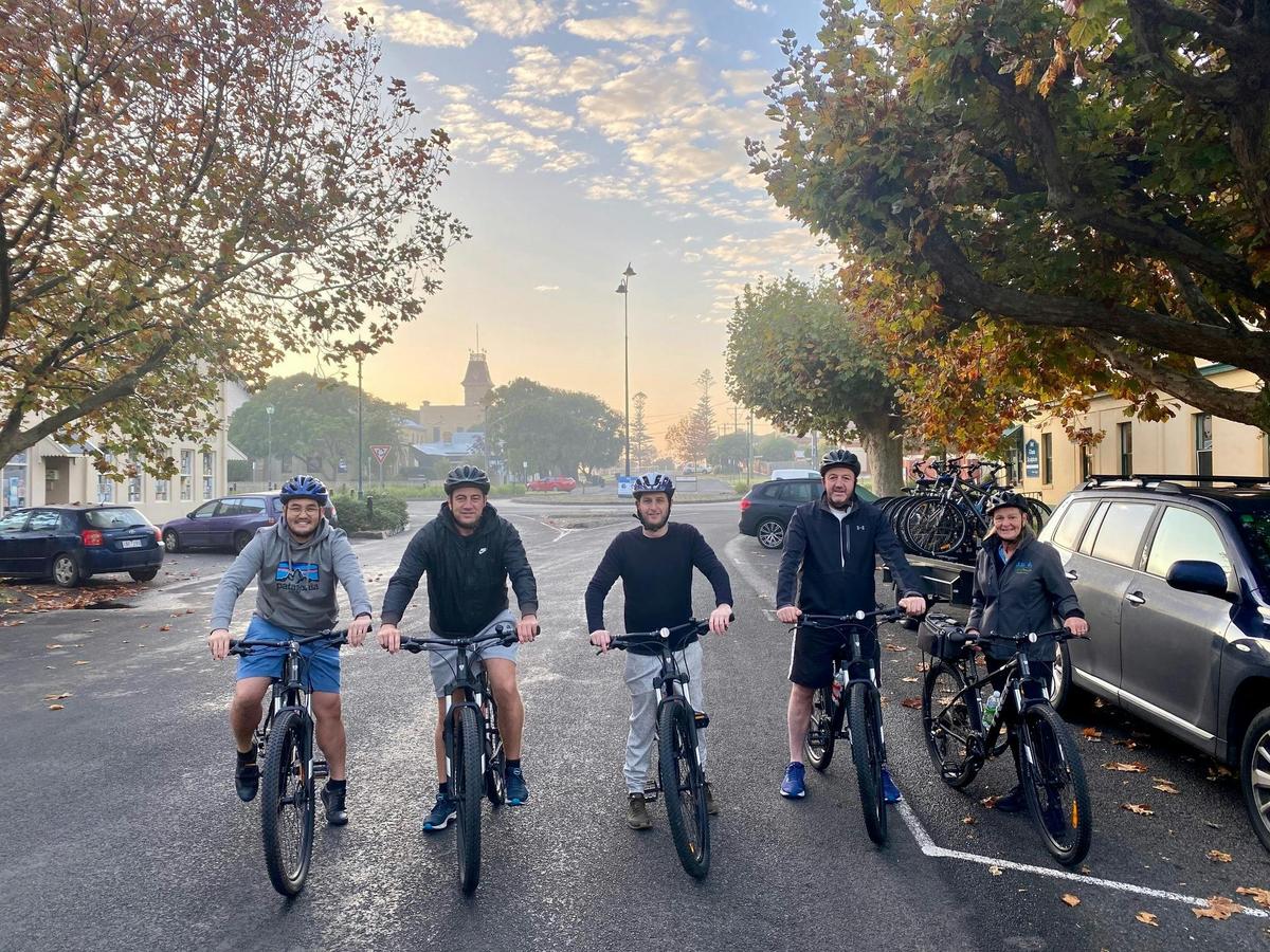 Cyclists heading off on early morning Cycle Tour from Queenscliff