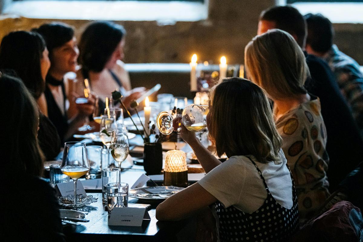 Long table of friends at Dessous