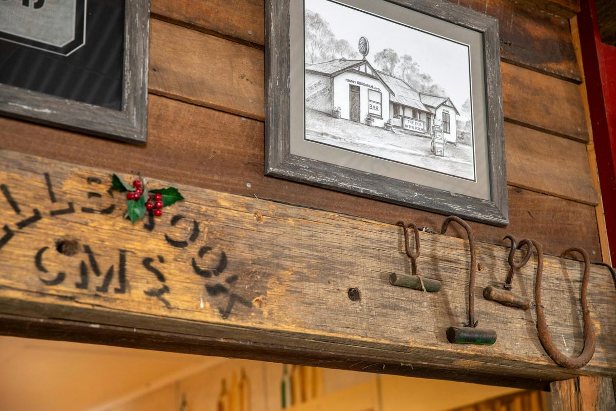 A framed picture on the wall of a rustic country pub