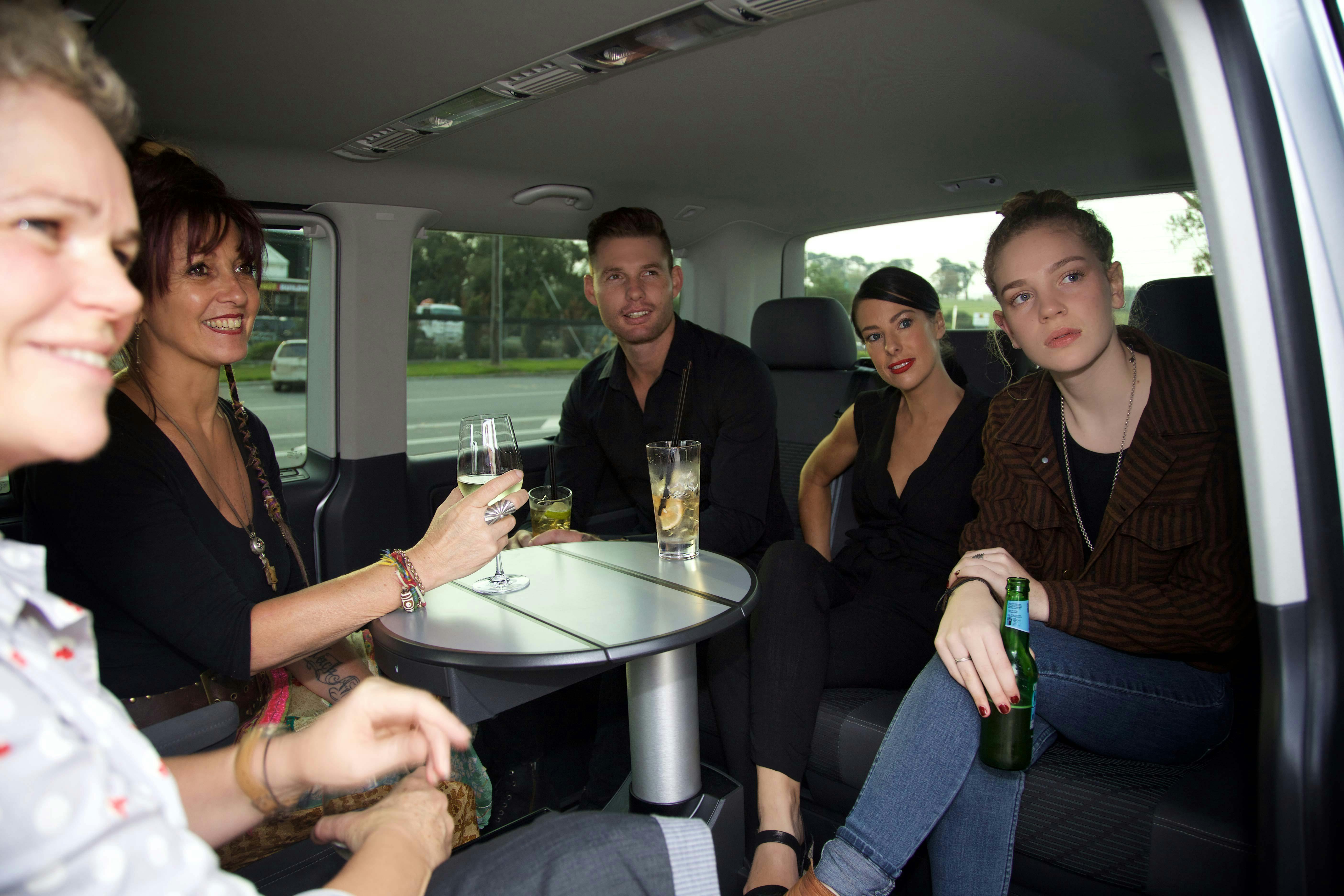 Guests enjoying the luxury Driven Indulgence touring vehicle