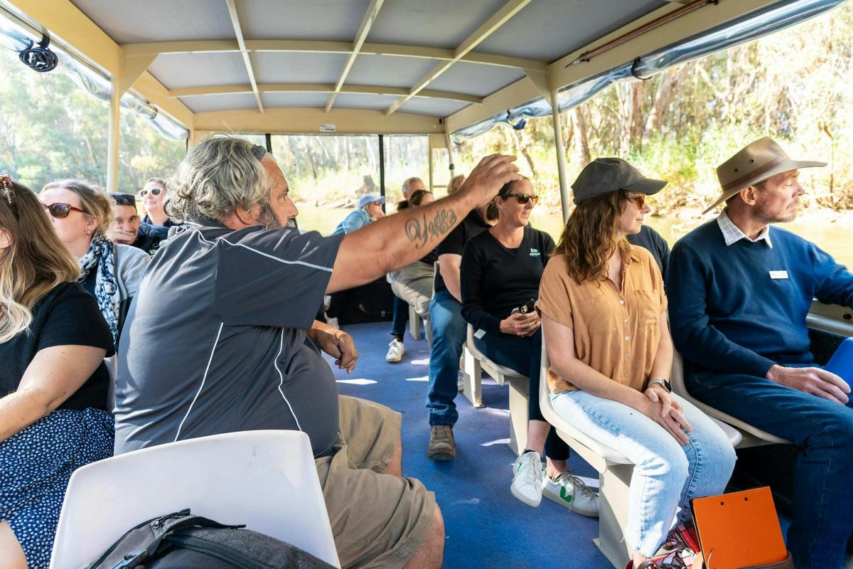 Guests on the Kingfisher River Cruise learning about Yorta Yorta culture and the natural environment