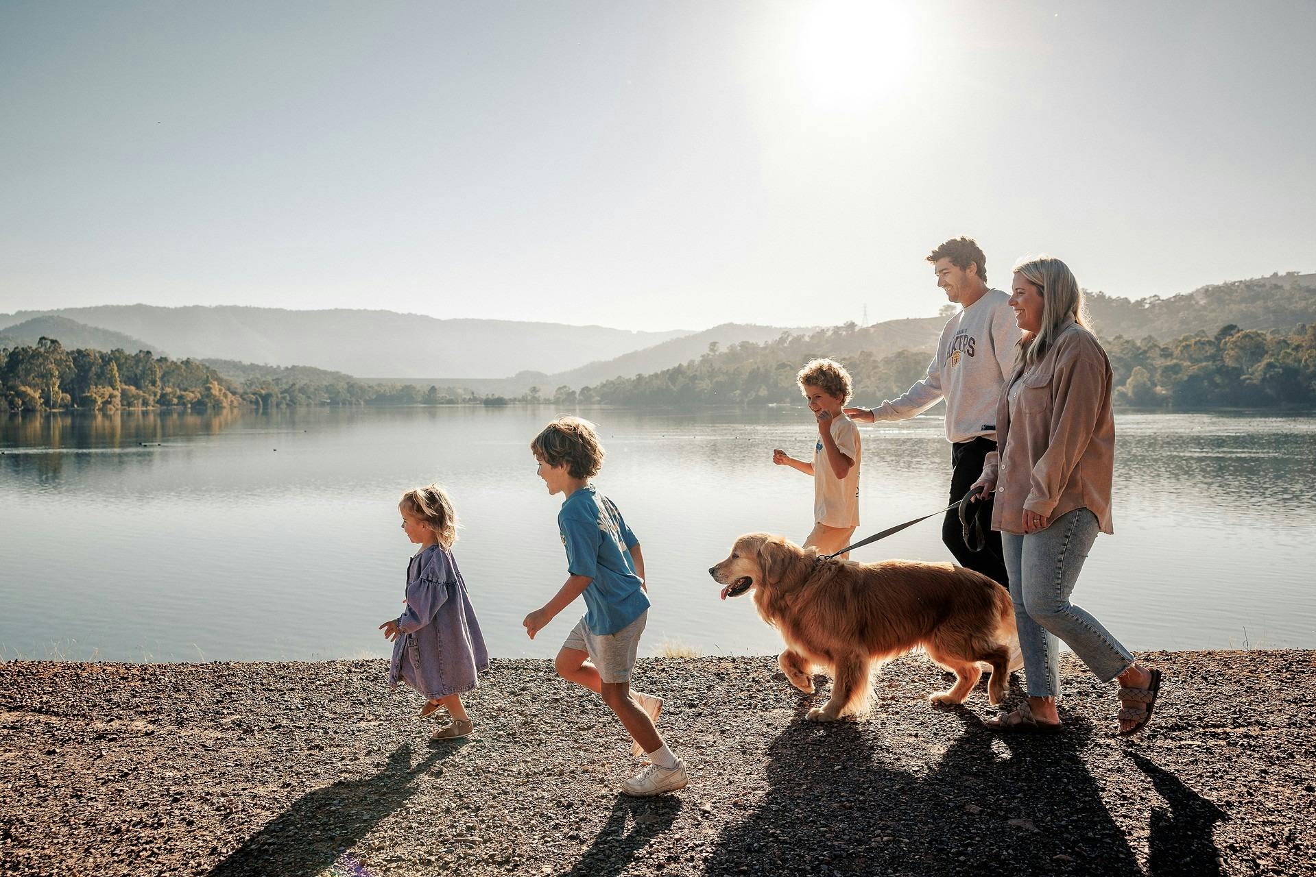 Family walking dog at Eildon Pondage