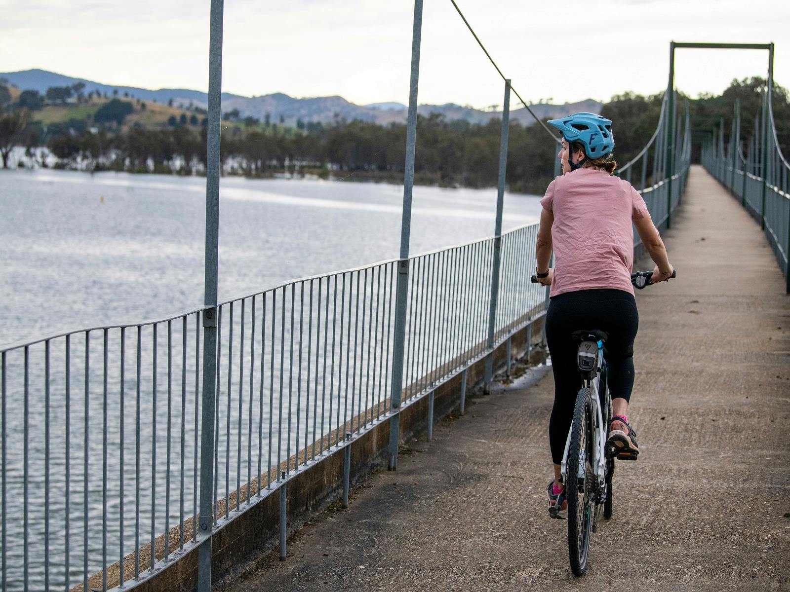 Solo cyclist crosses Bonnie Doon Bridge — a highlight of the Great Victorian Rail Trail
