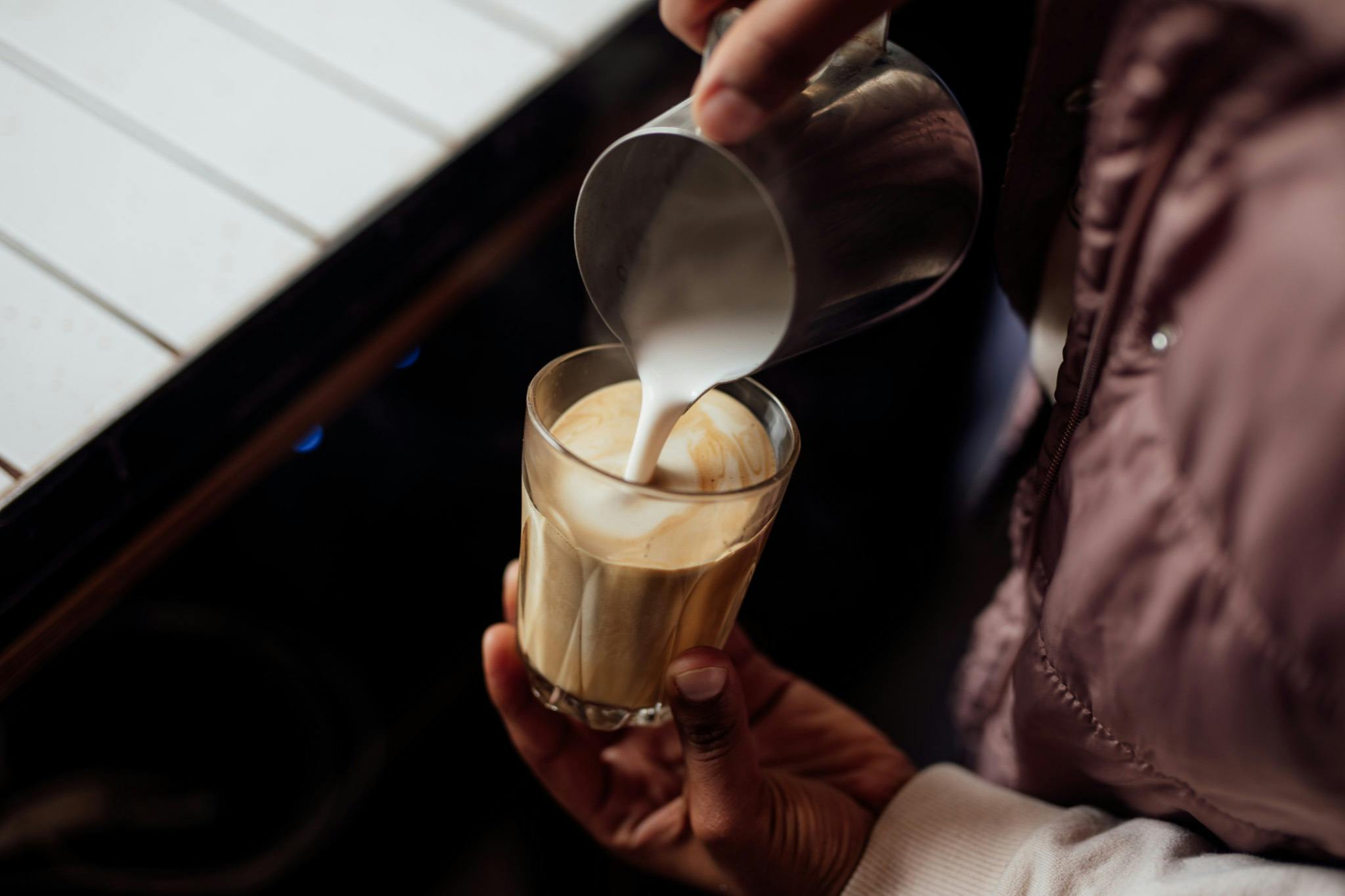 Barista pouring latte art