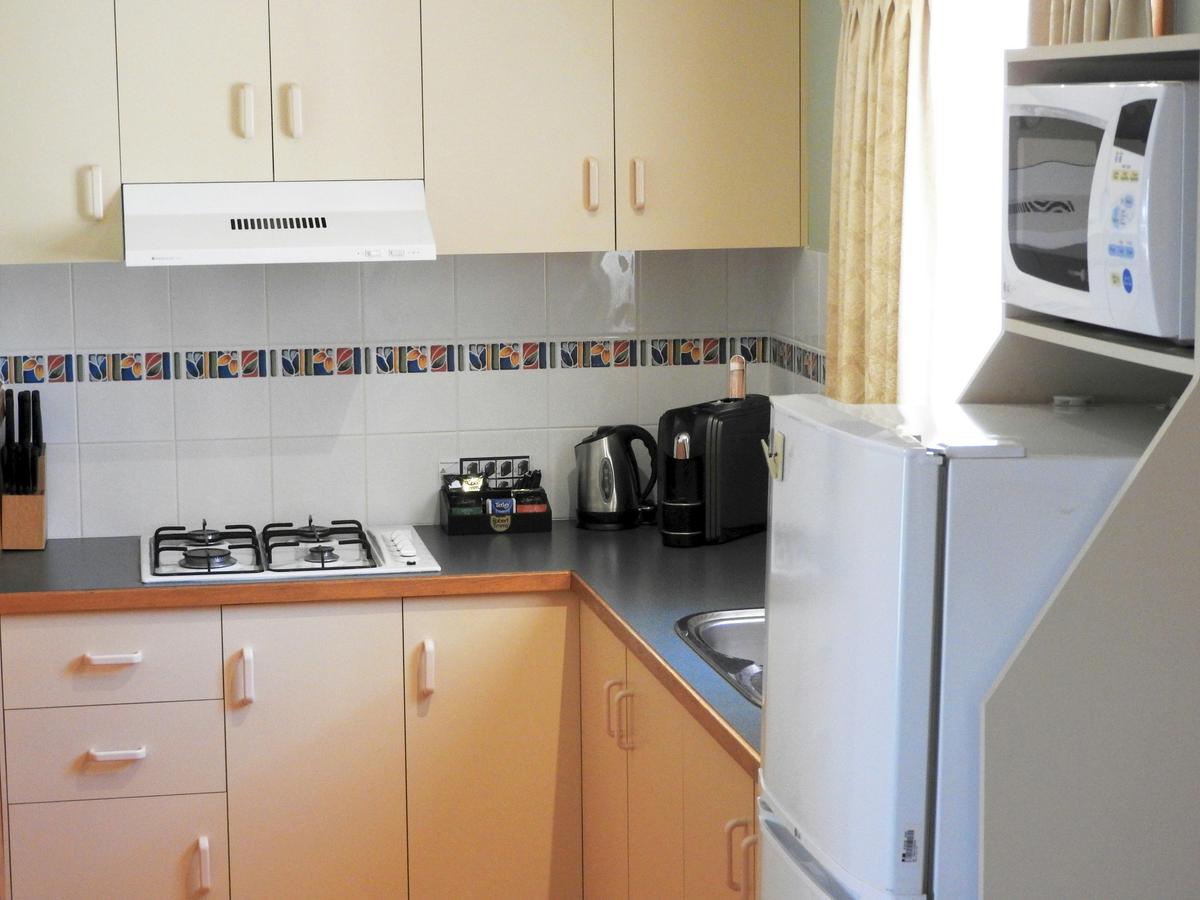 Kitchenette featuring Gas Cook Top, microwave oven, coffee pod machine