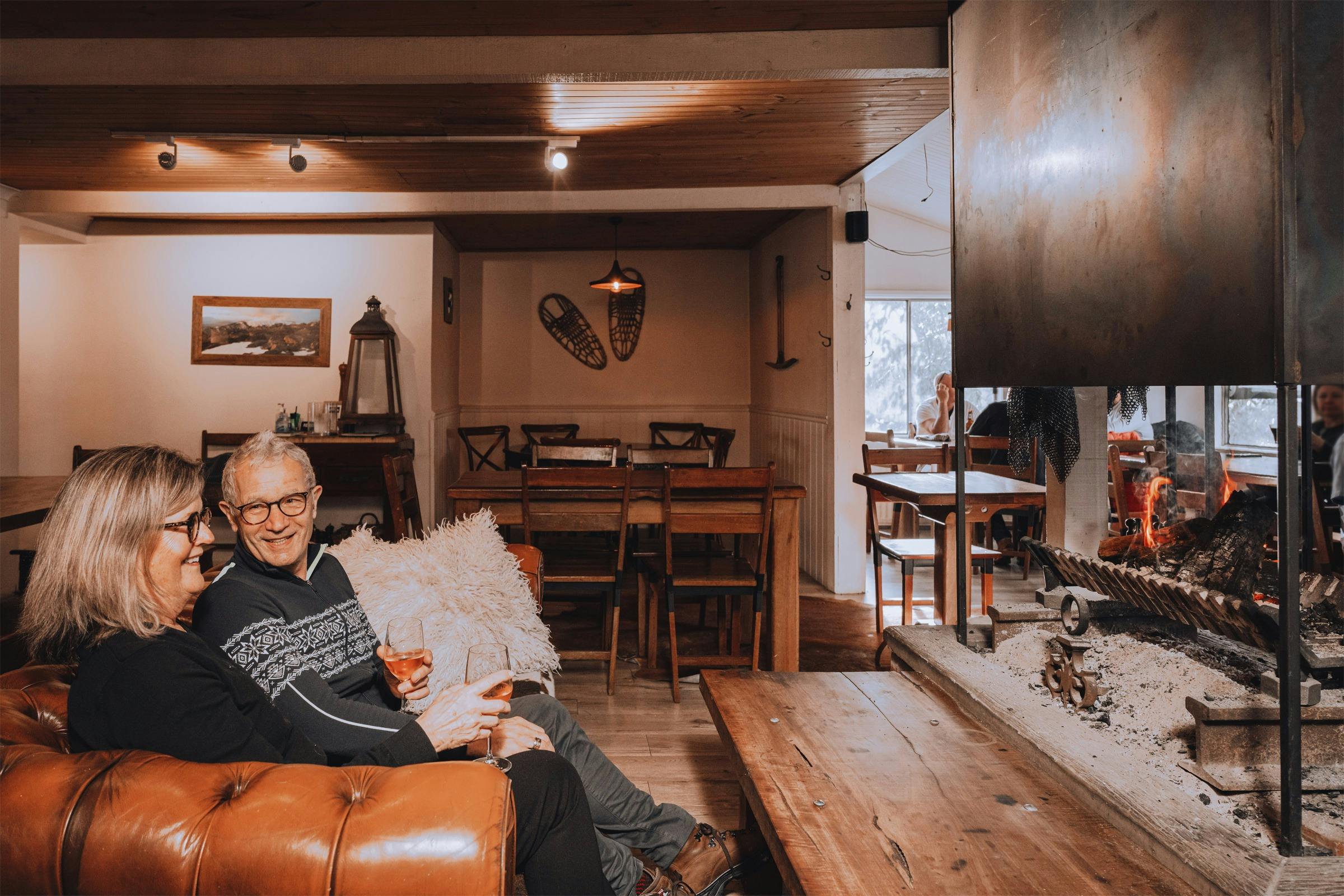 Relax by the Crackling fire, soft music, Negroni in hand — alpine nights done right at Feathertop!