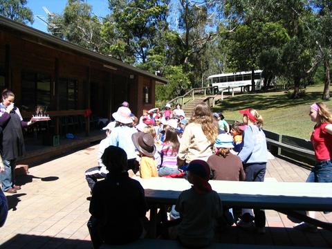 Bunjil Centre, with indoor & outdoor eating areas, pool and lawn.