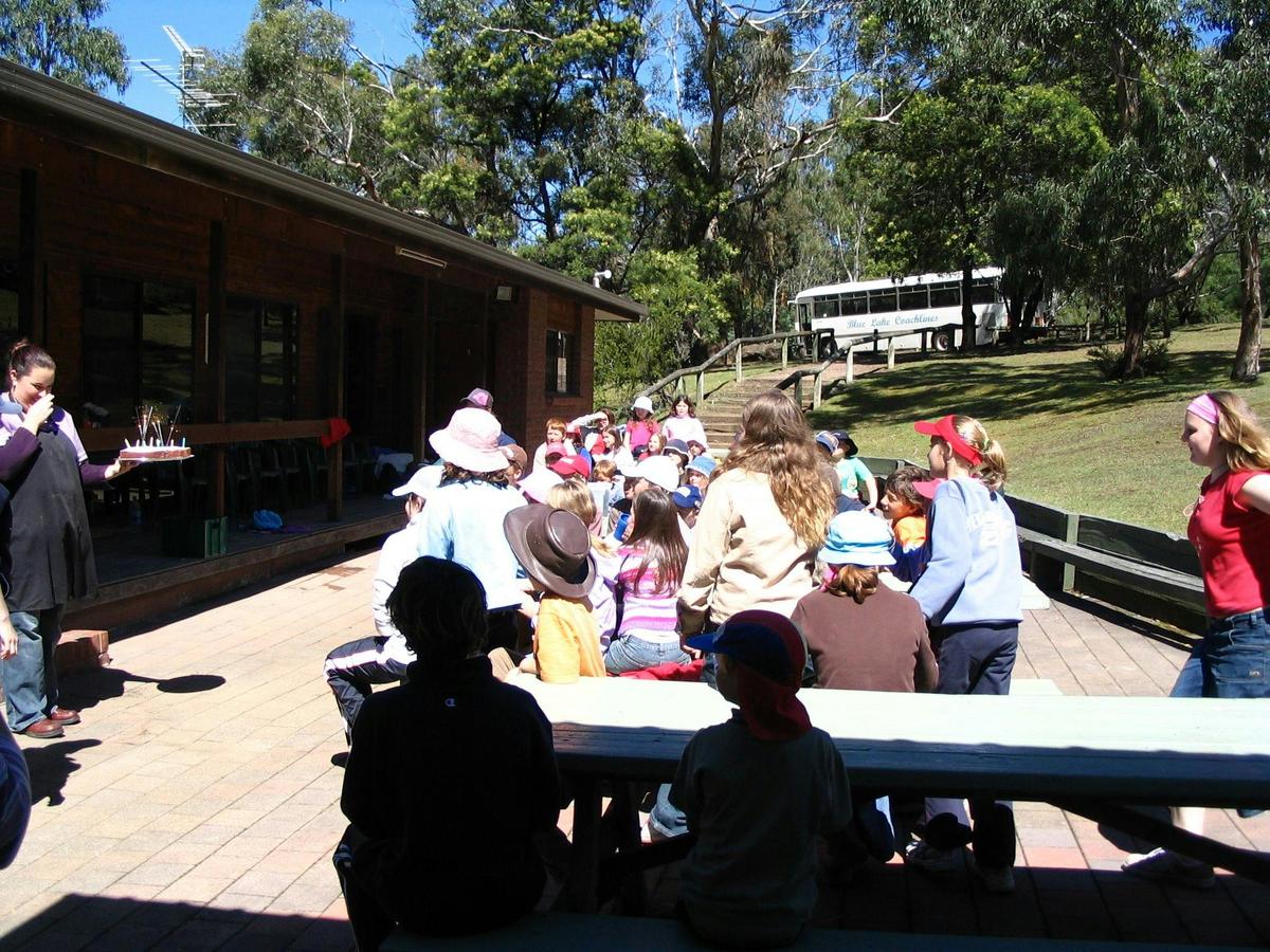 Bunjil Centre, with indoor & outdoor eating areas, pool and lawn.
