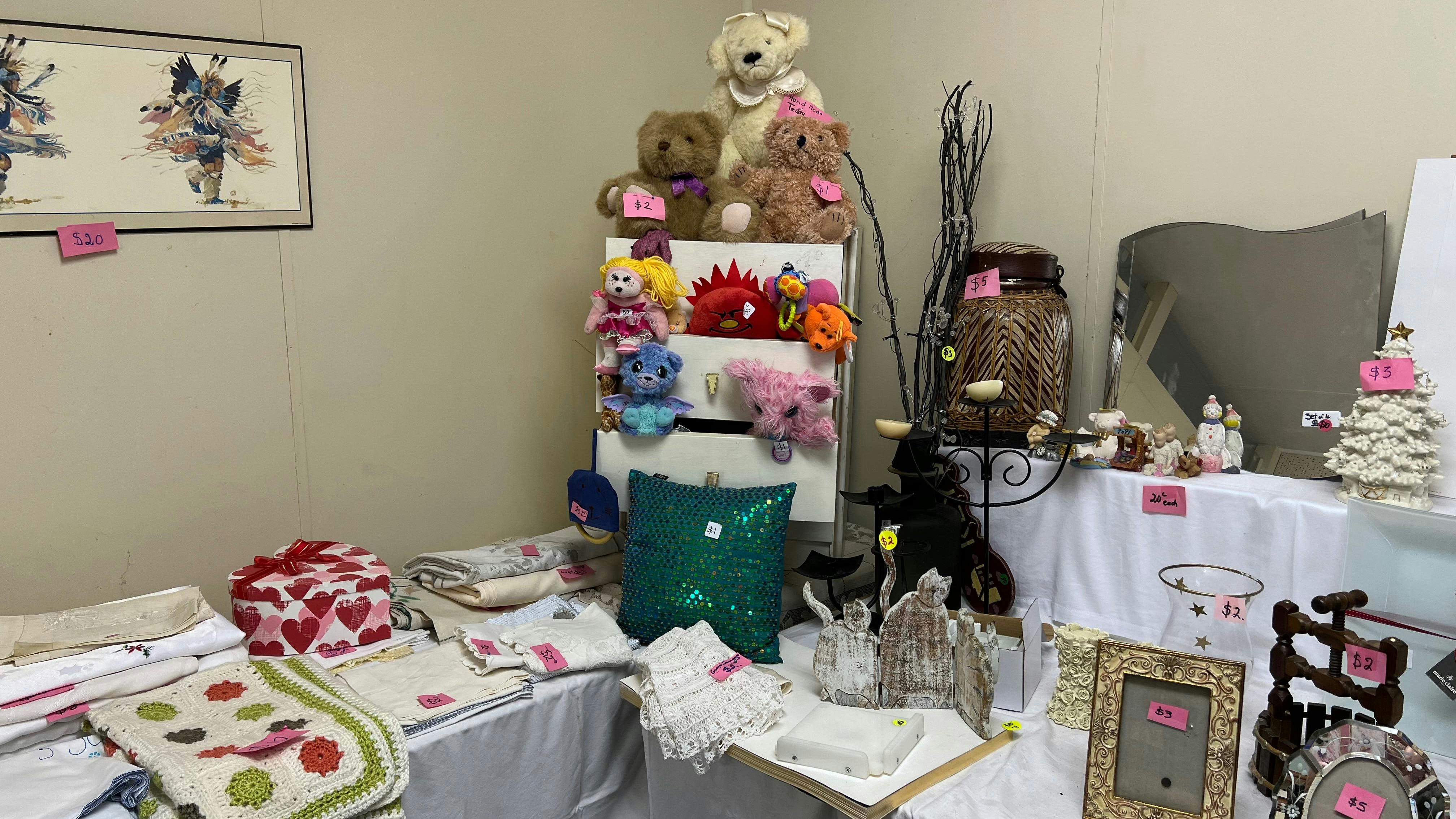 To the right is a room with baby and linen.