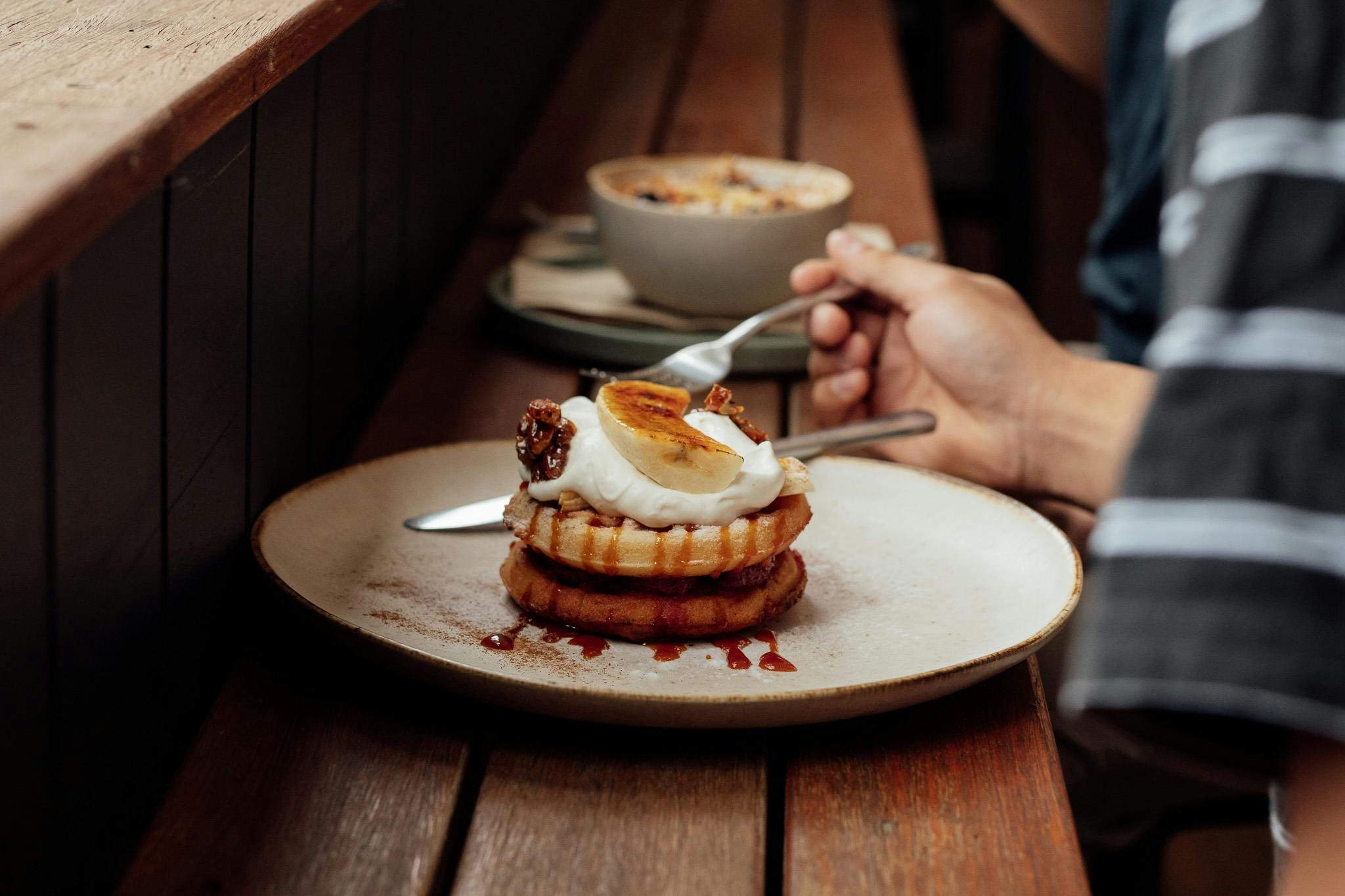 A customer eating the waffles