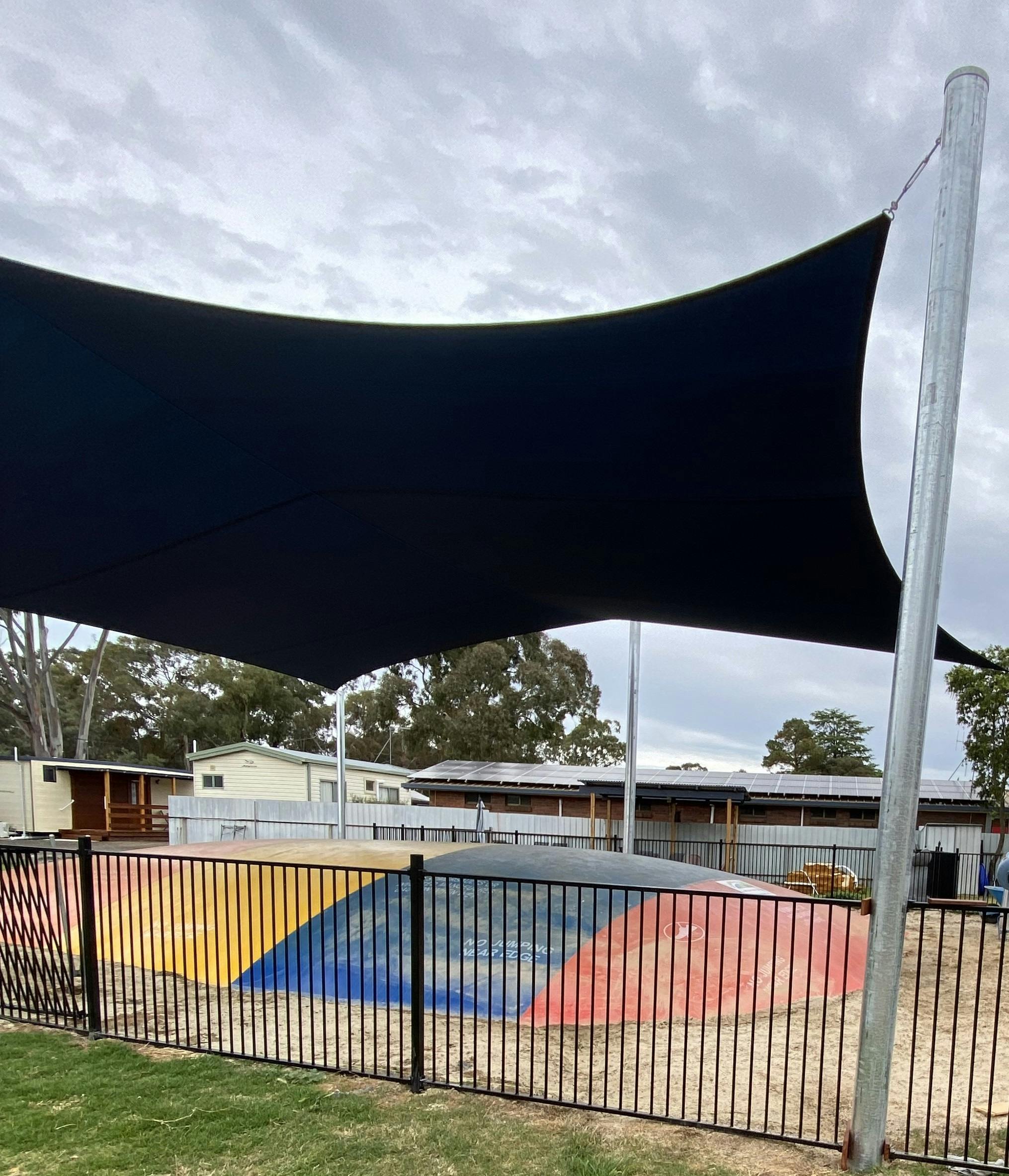 Shaded and fenced jumping pillow