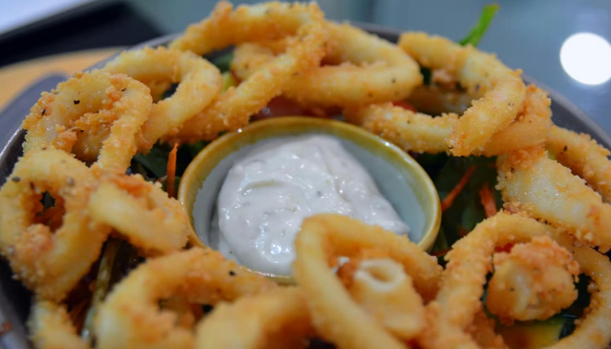 People sitting on seats in a garden area