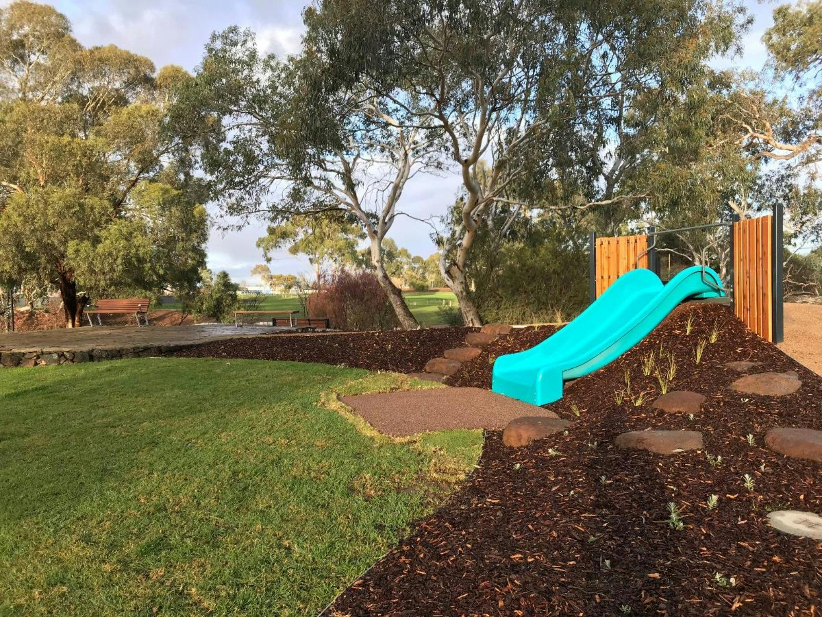 small slide and hill area in playground