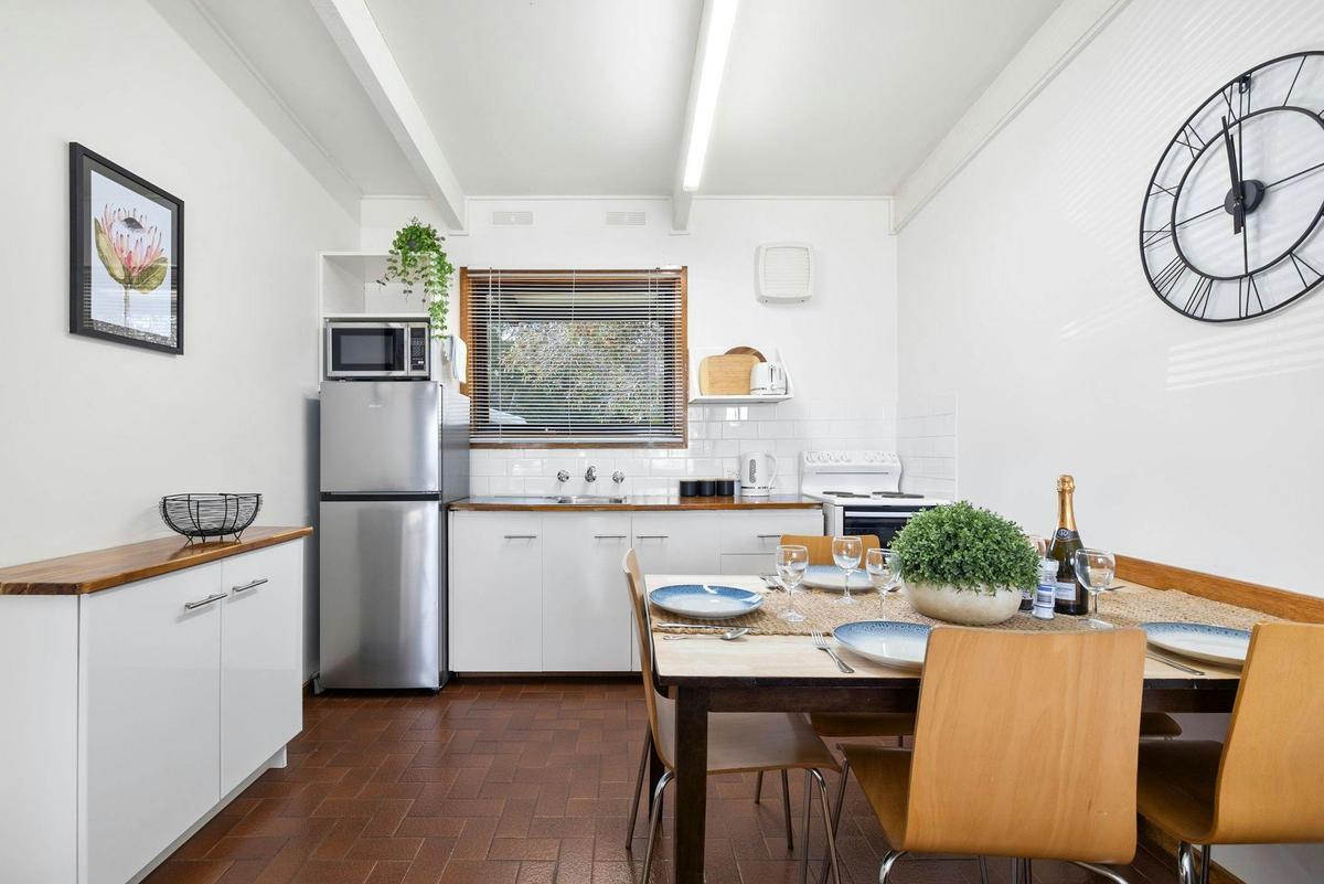 a open kitchen including a dining space