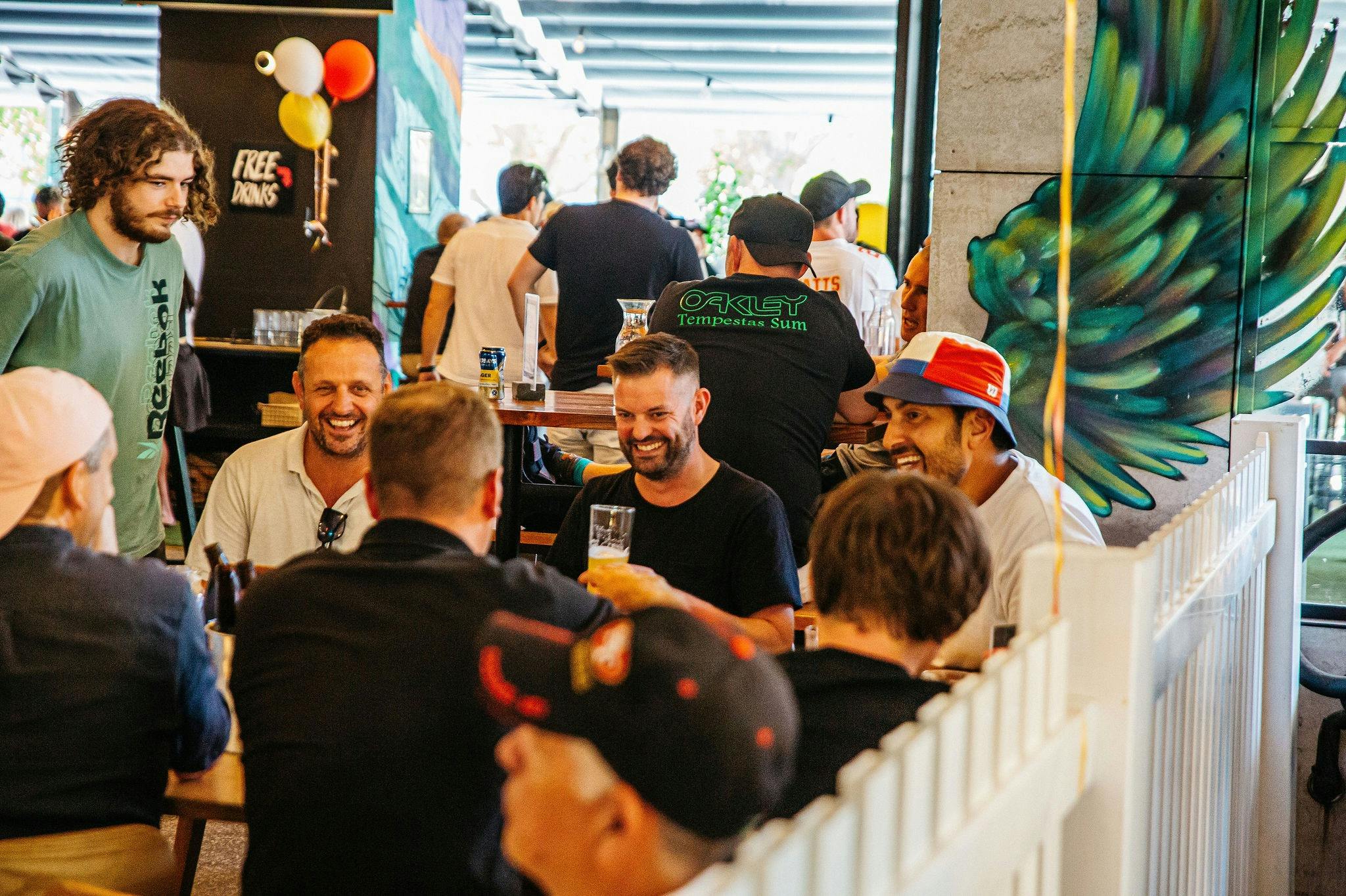 Enjoy the open plan, inside-outside space & bright pops of colour.