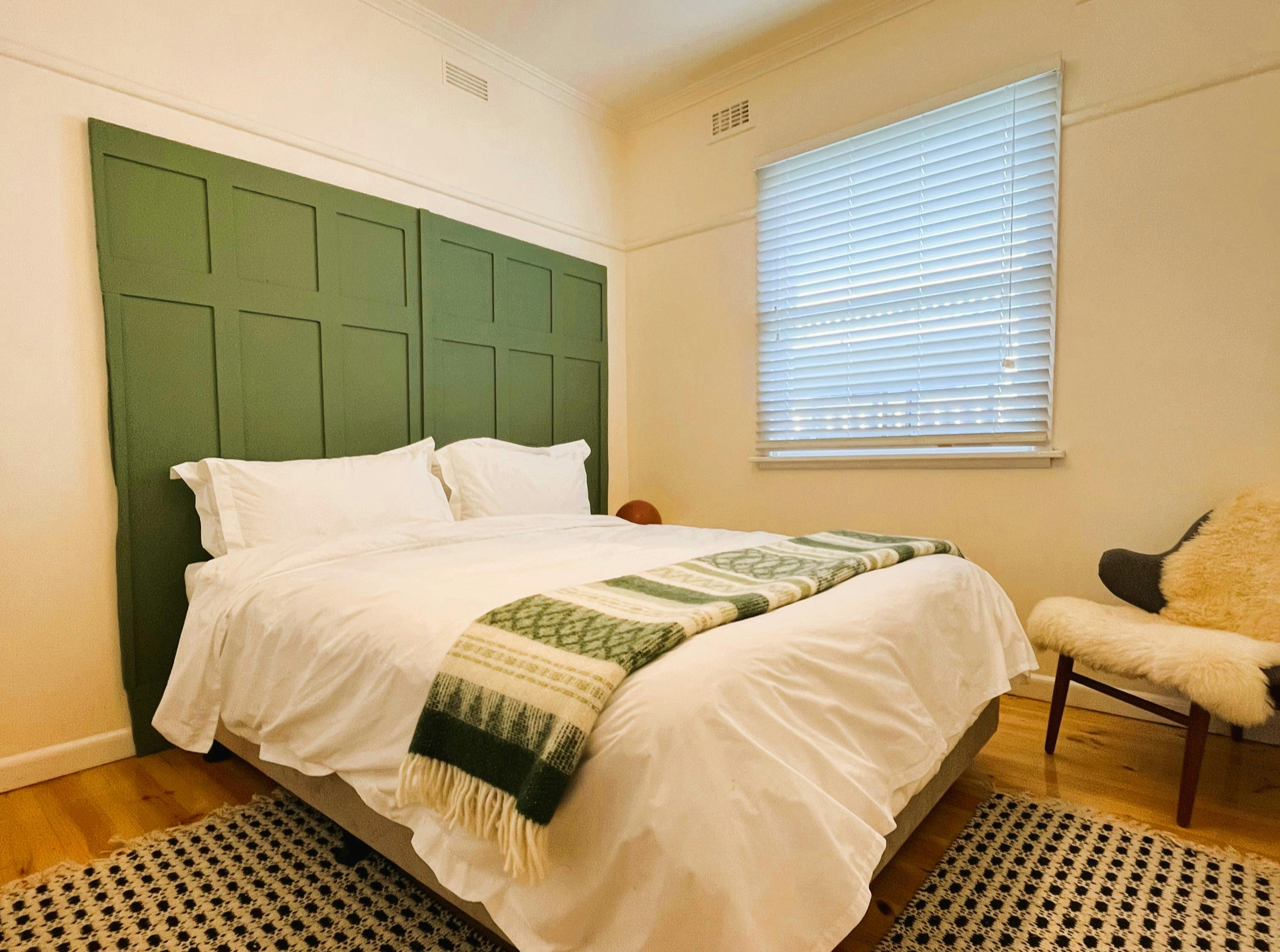 Relax in comfort: queen bed, choice of pillows, and cozy Ballarat stay vibes.