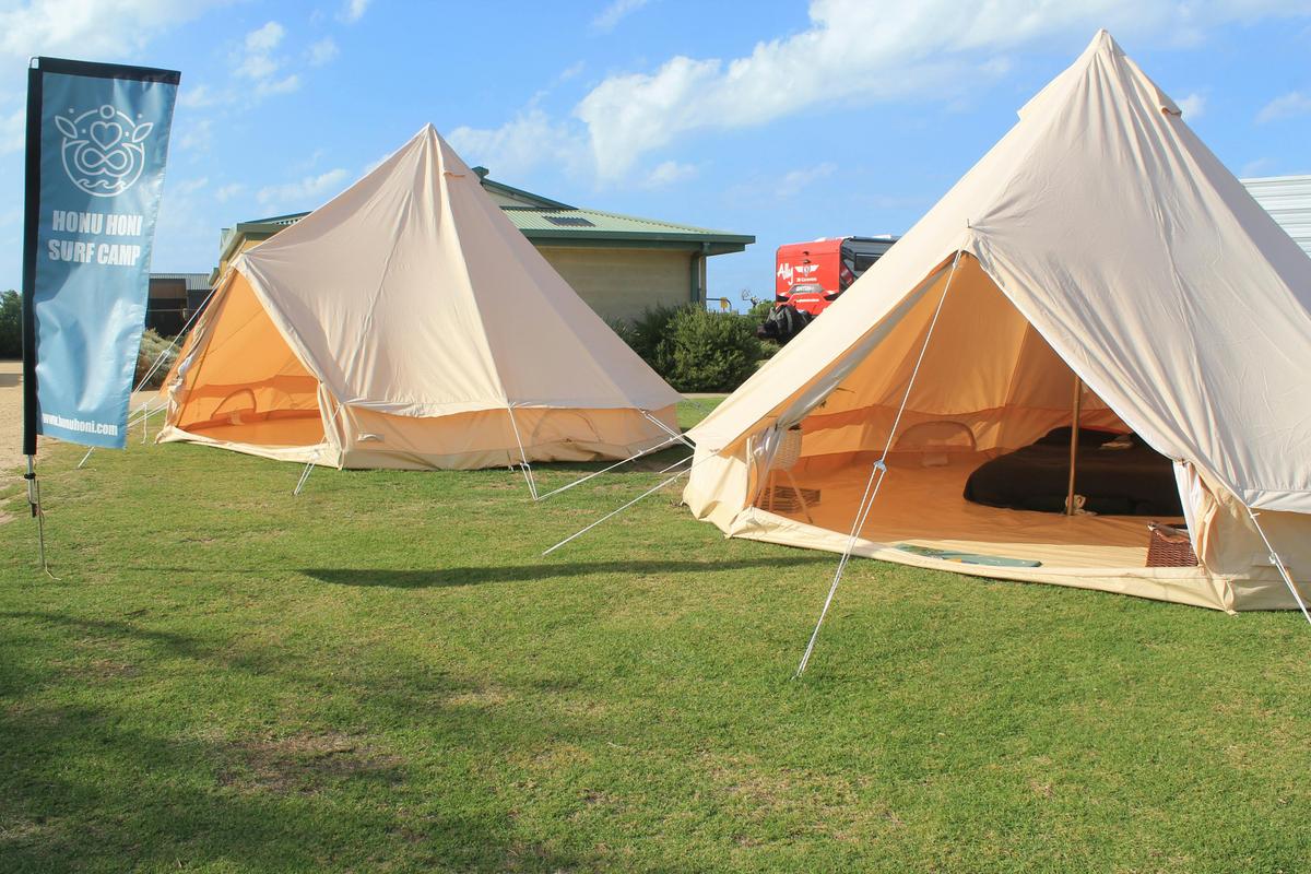 Two luxurious glamping tents ready for surf camp guests.