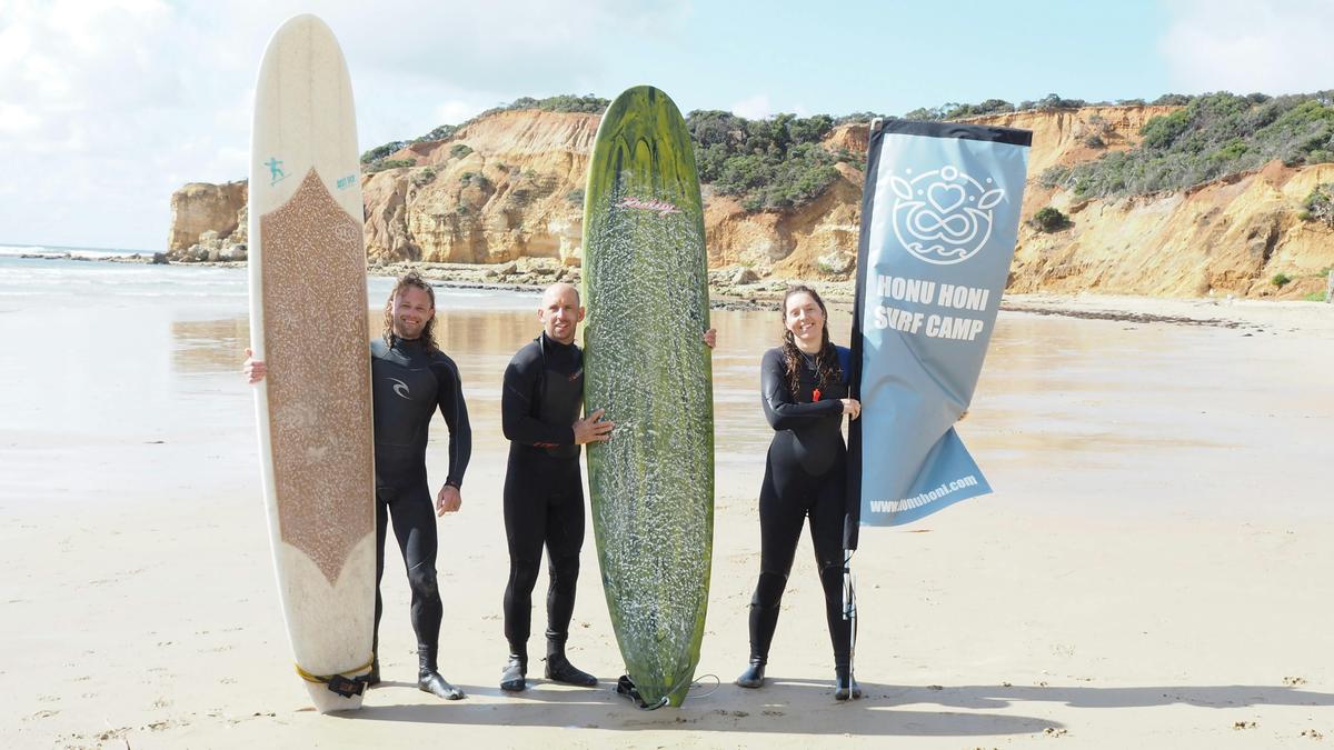 Intermediate surfers post surf lesson.