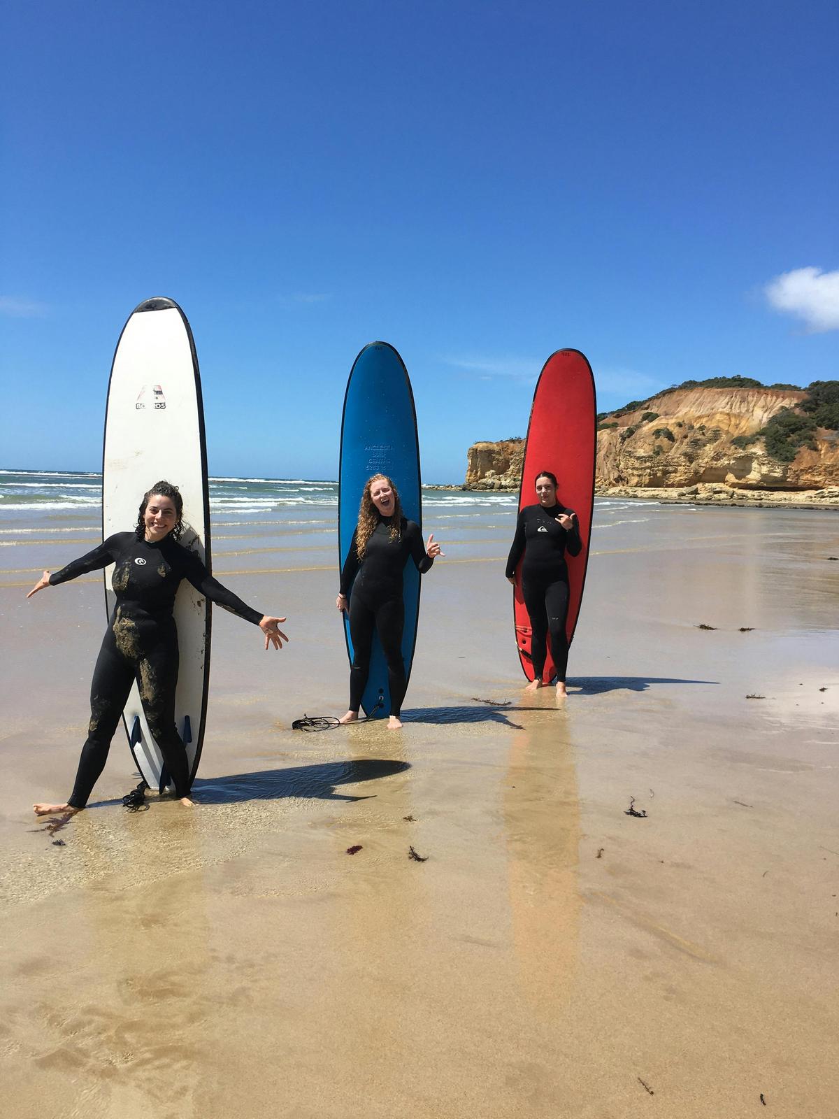 Three surfers after their beginner surf lesson!