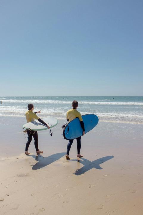 Checking the waves and heading out.