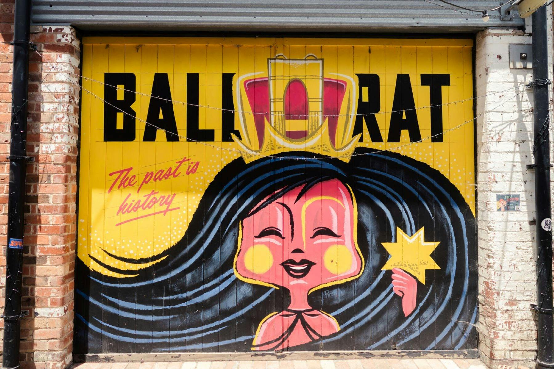 a red and yellow coloured mural