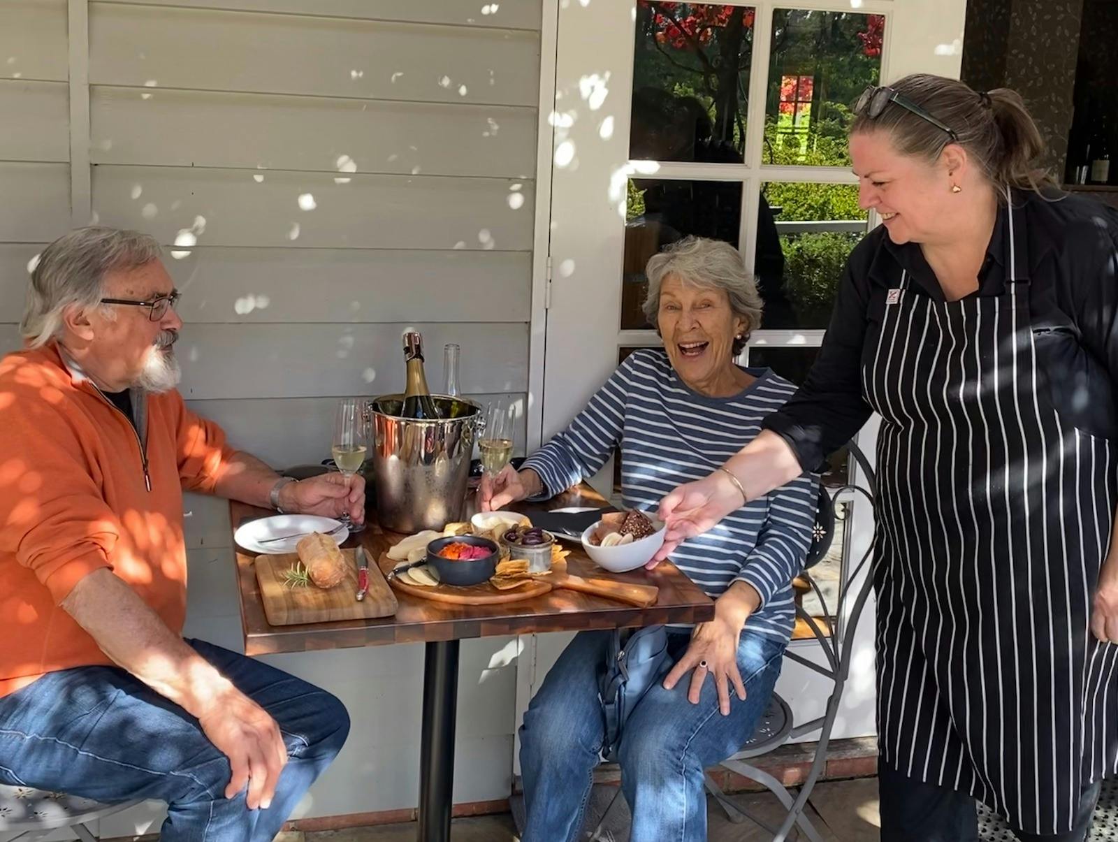 Patrons enjoying share platter lunch and wine