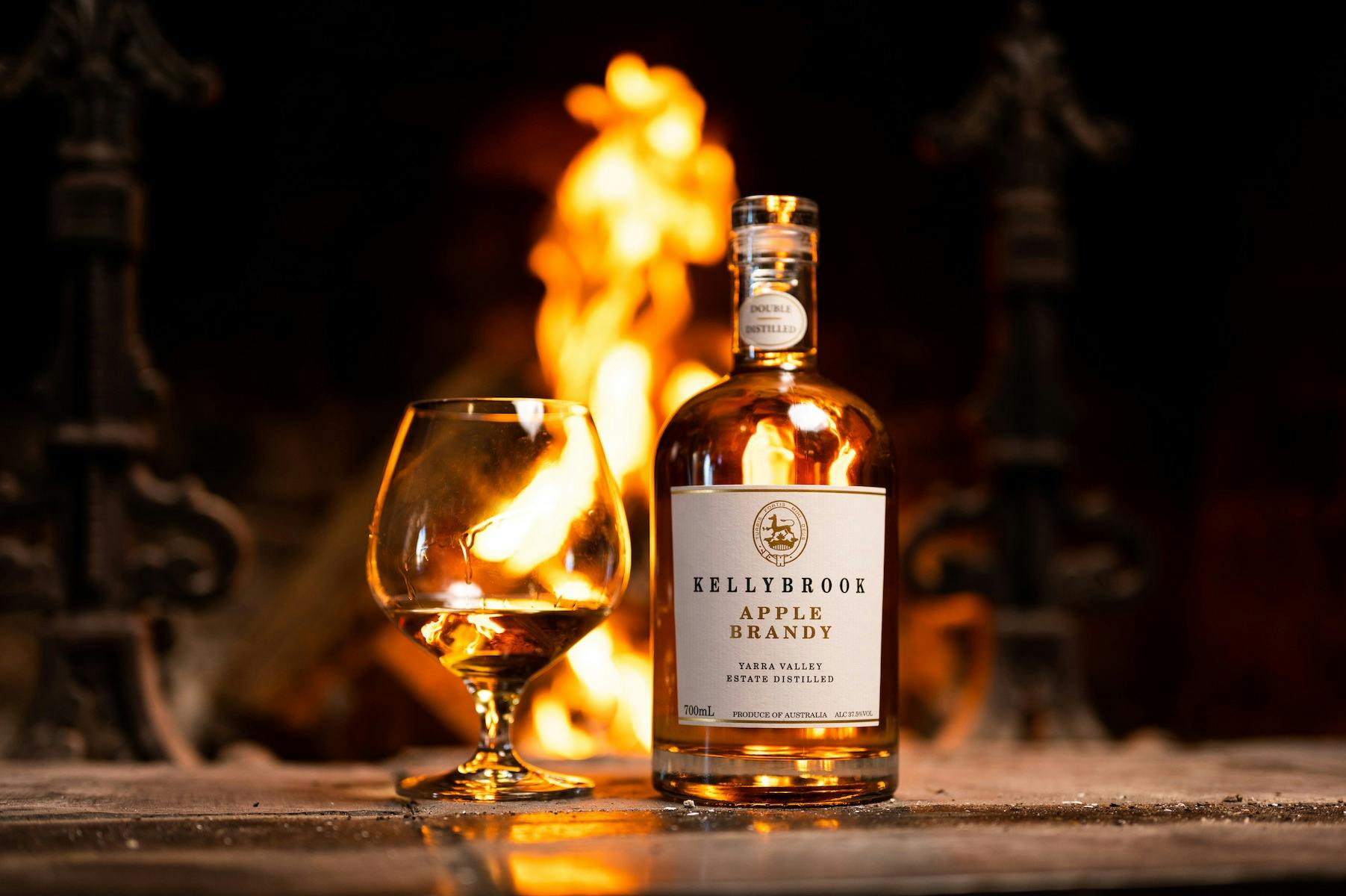 Kellybrook Apple Brandy in front of fire
