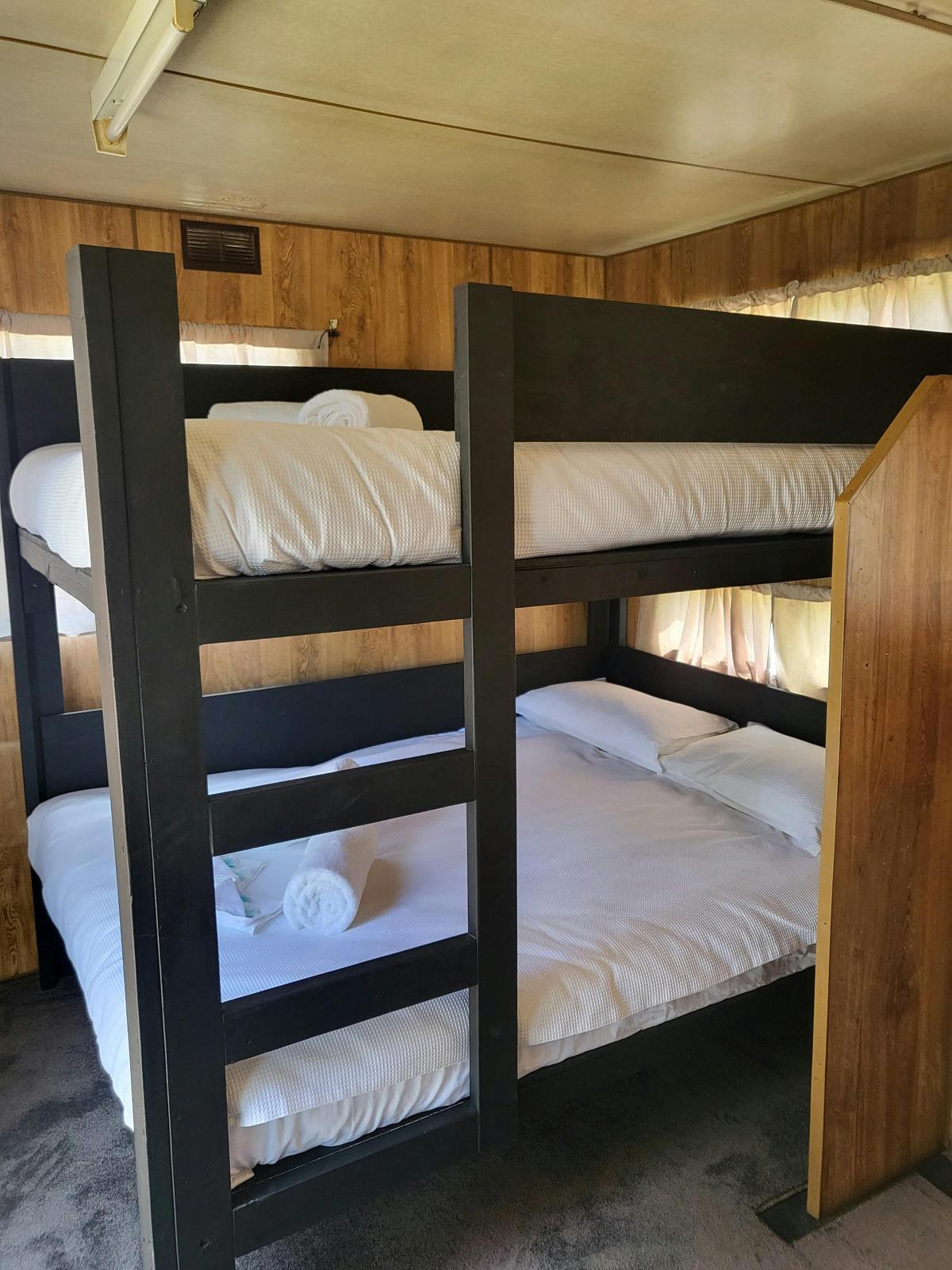 Comfortable bunk bed setup with fresh linens in a cabin 2 at Kangaroo Lake Hotel Motel accommodation