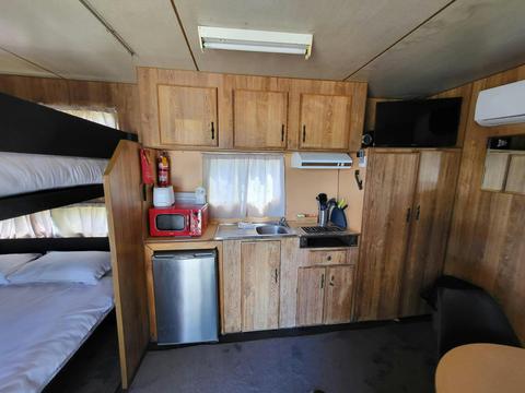Cozy cabin with bunk beds and kitchenette at Kangaroo Lake Hotel Motel Accommodation