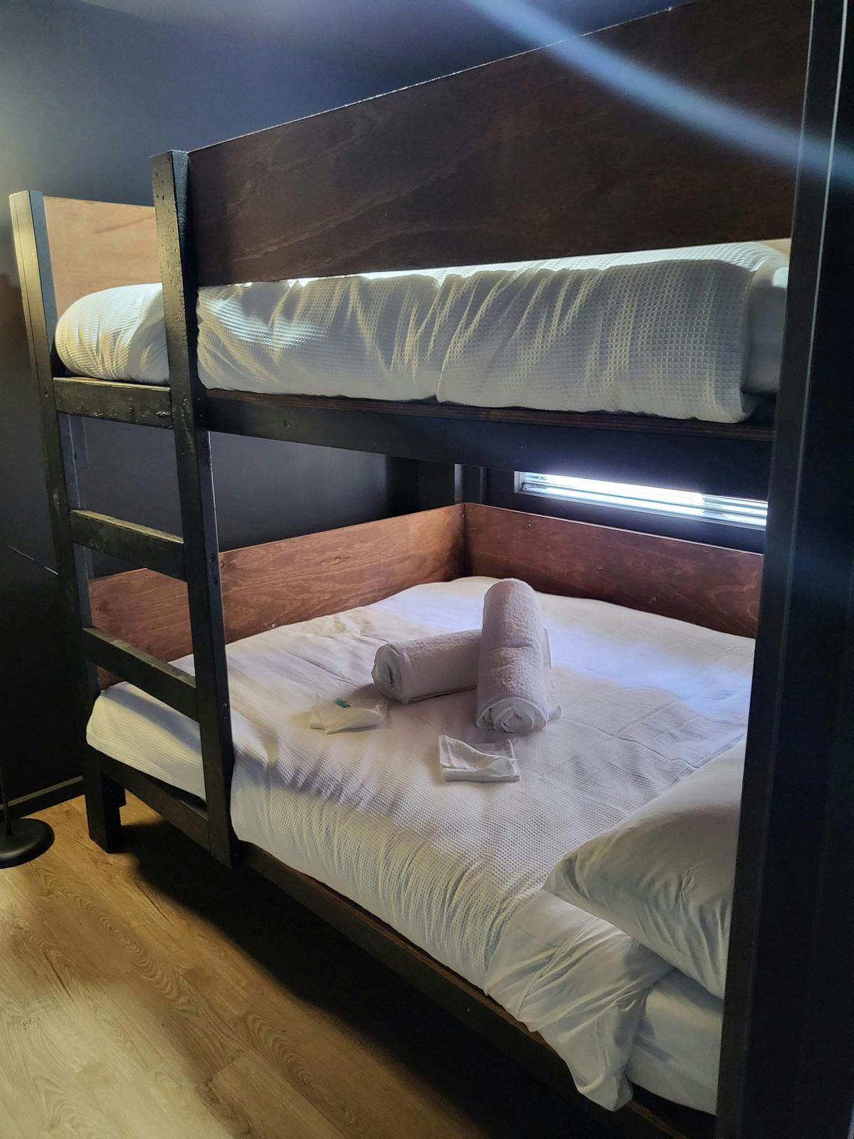 Cozy bunk beds in Cabin 10, perfect for families