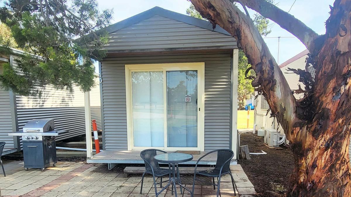 Relax at Cabin 10 with a private patio and barbecue