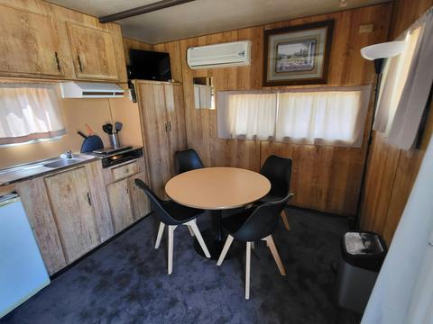 Cabin 4's dining area offers a modern table setup for a delightful meal