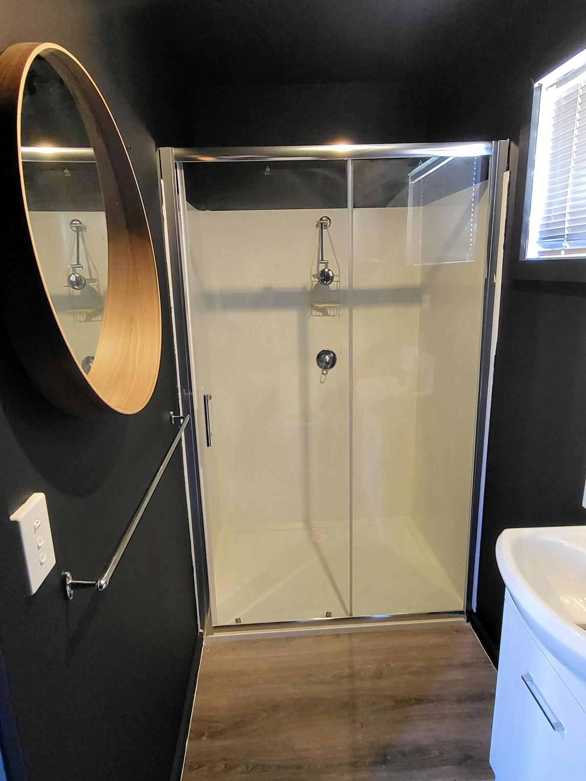 The stylish bathroom in Cabin 15 offers modern amenities