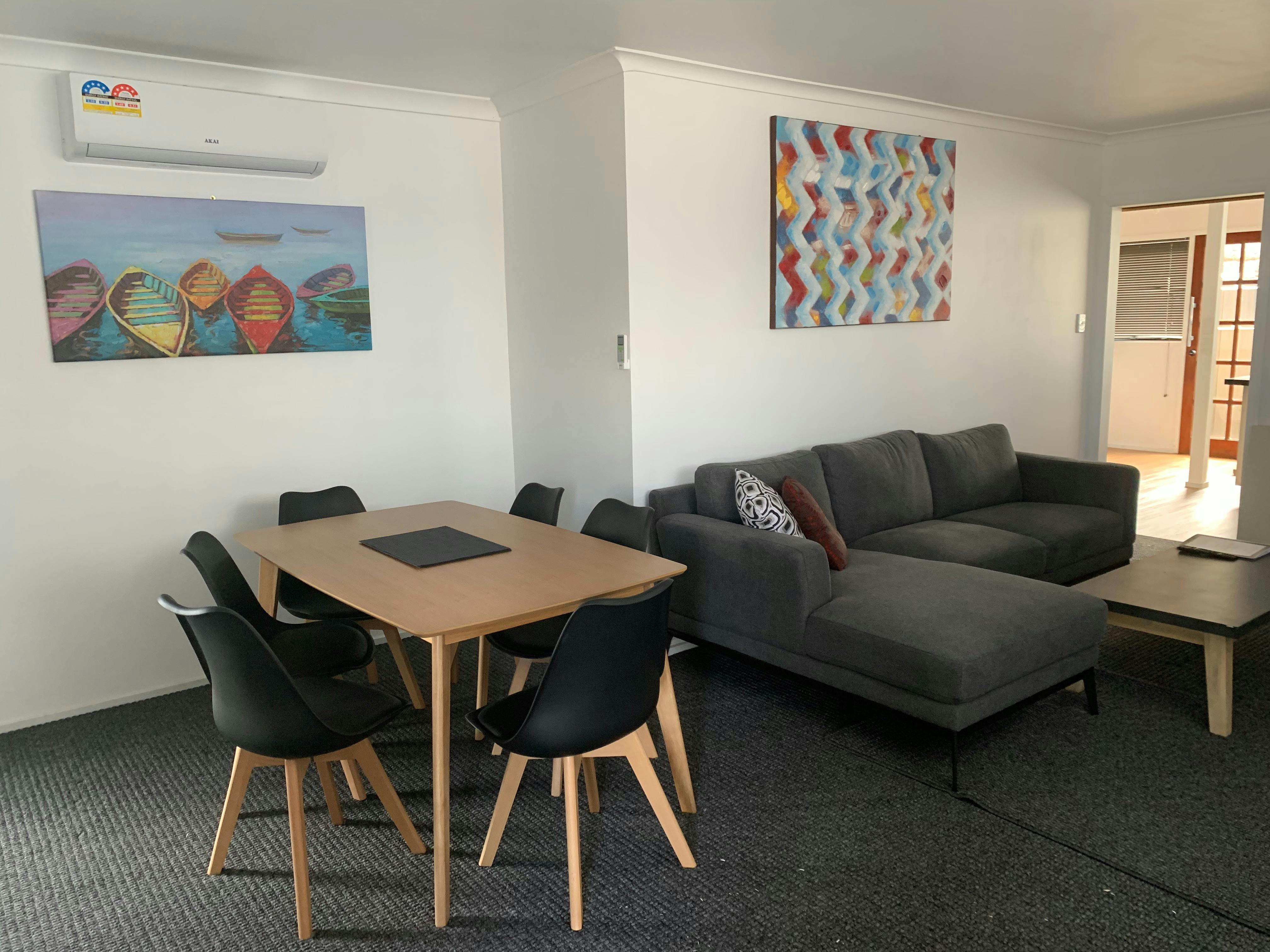 Apartment - dining table and lounge room
