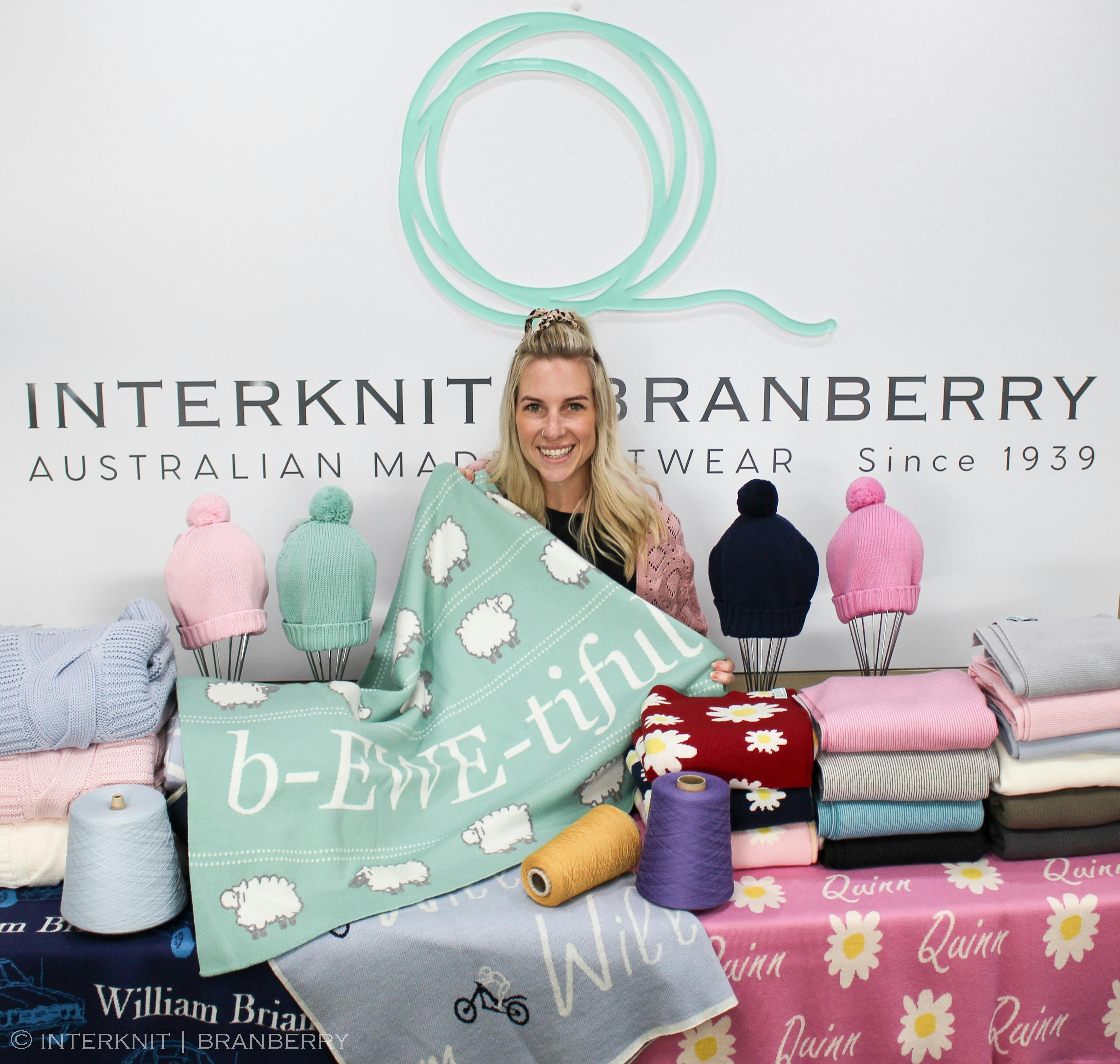 Owner of the business with some showcasing our woollen knitwear