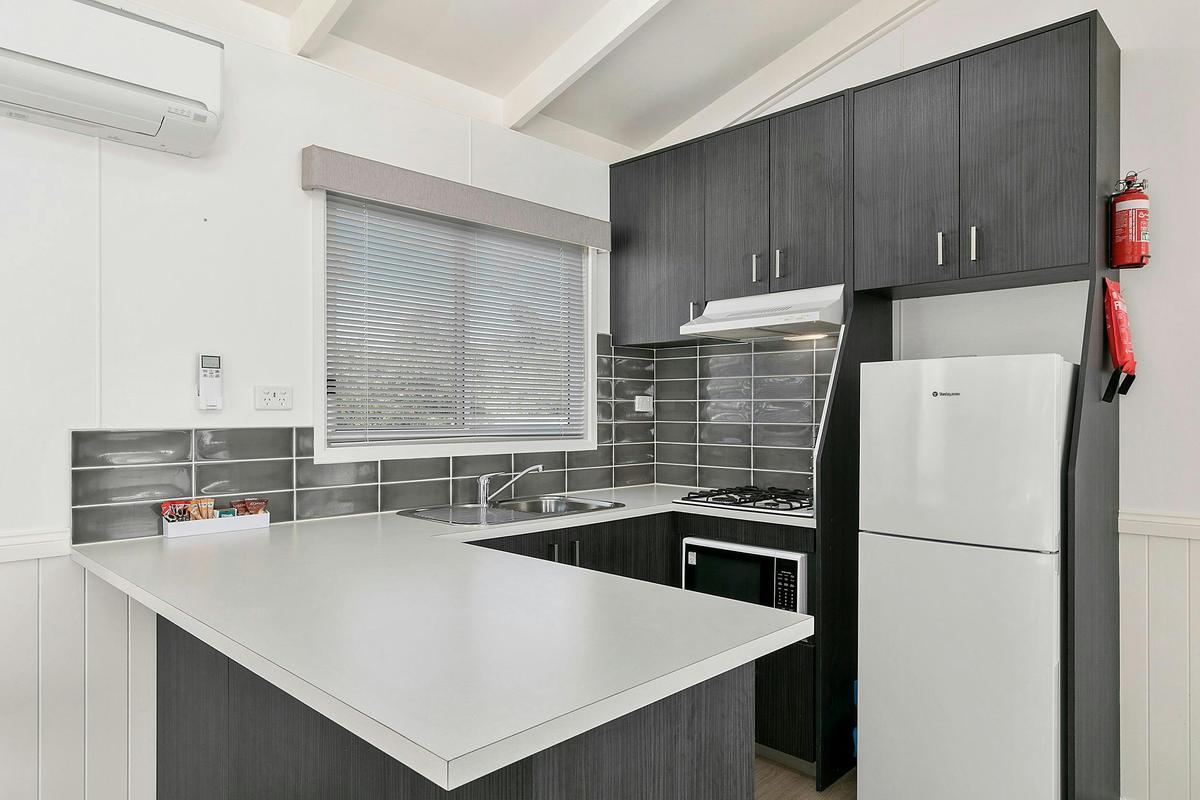Modern kitchenette with stove stop