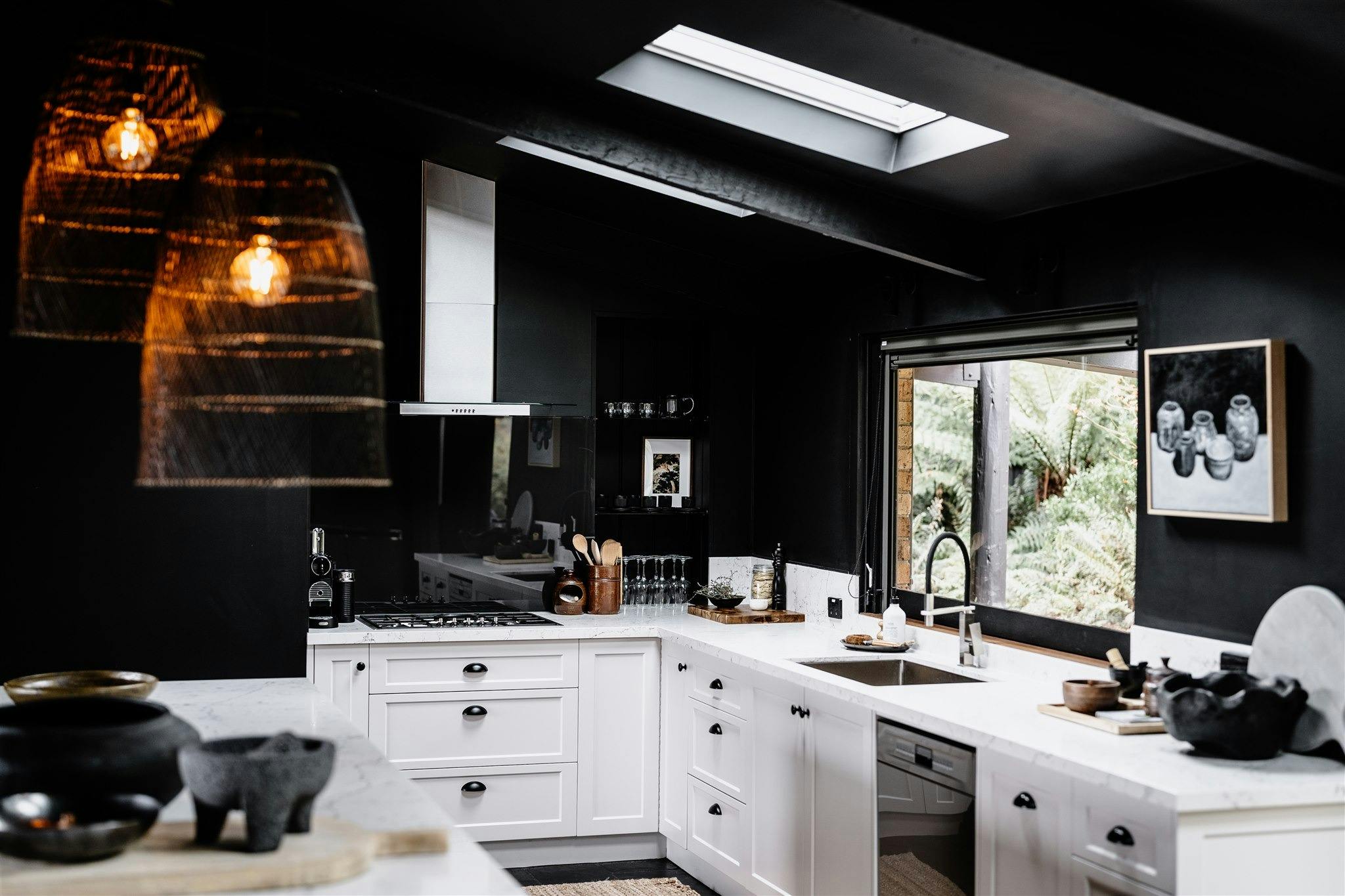 Jumoku Kitchen with black walls and white furnishings