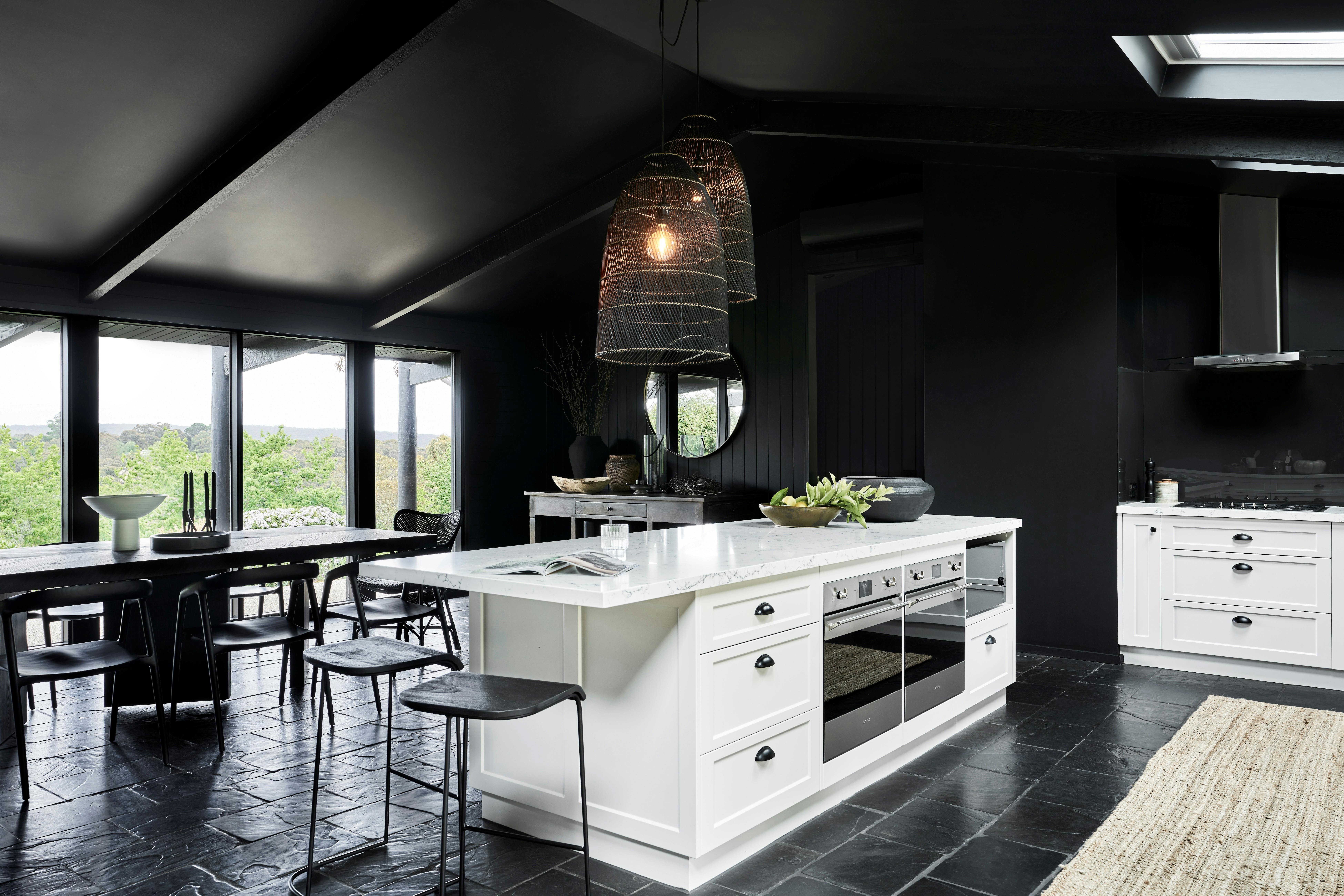 Jumoku Dining with black walls and white furnishings