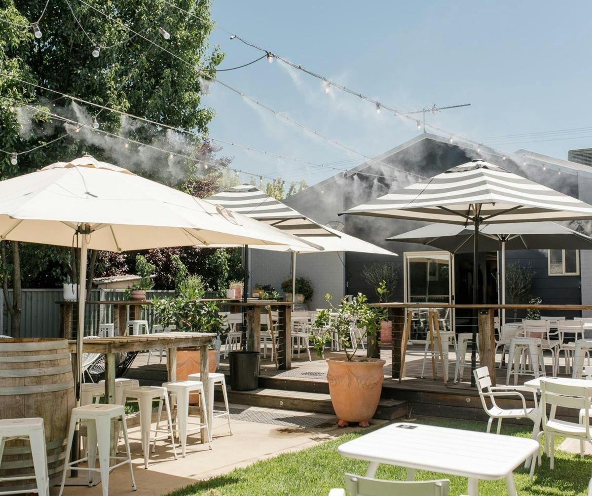 Enjoy the outdoor area (off the Main Street at rear of our cellar door) with misting system.