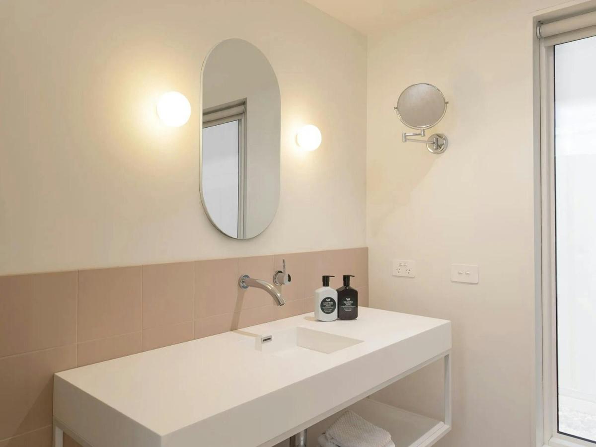 sink, taps, toiletries and mirror in the Kar-Rama Hotel Superior King Room