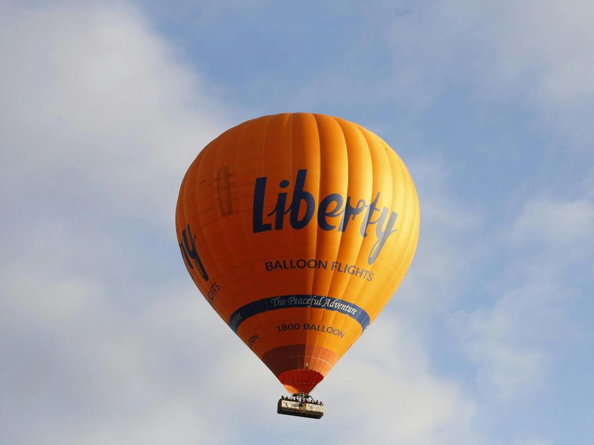 Hot air balloon drifting through the clouds during a serene flight